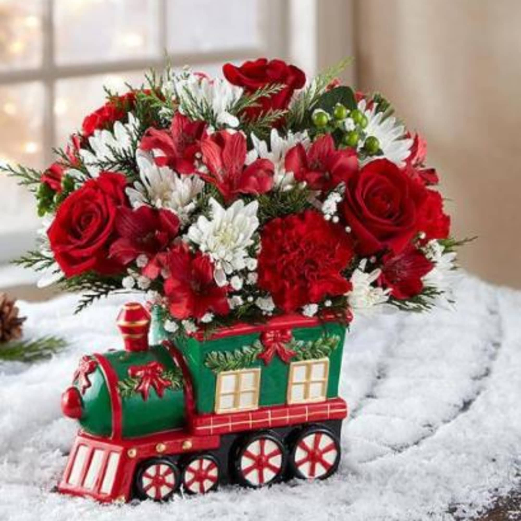  Our keepsake Christmas train arrangement will be pulling into the homes
