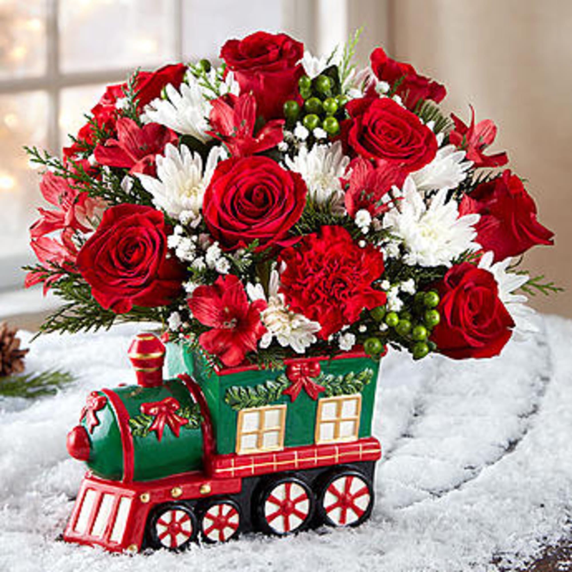  Our keepsake Christmas train arrangement will be pulling into the homes