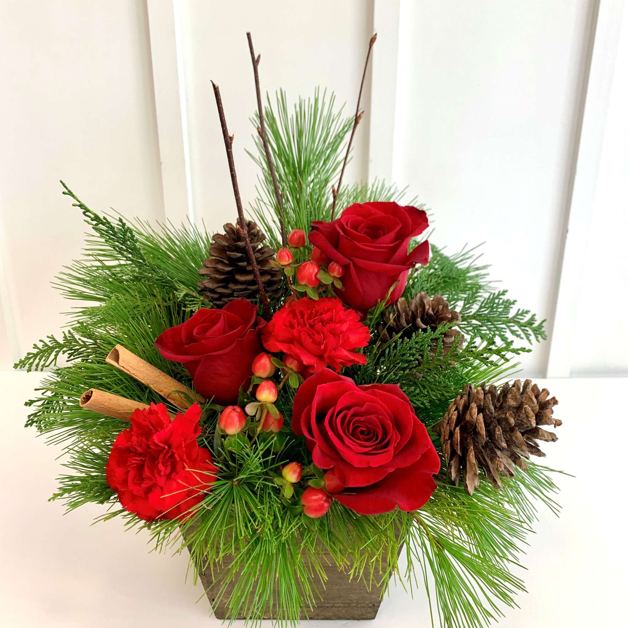 A festive arrangement that brings the spirit of Christmas into full bloom!
