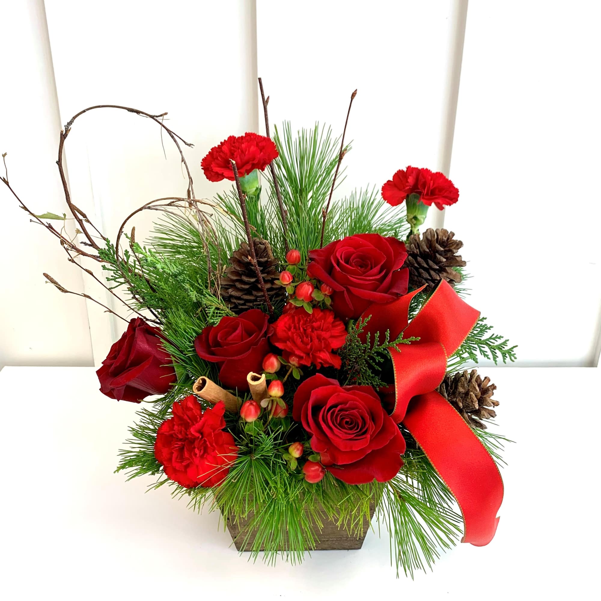 A festive arrangement that brings the spirit of Christmas into full bloom!