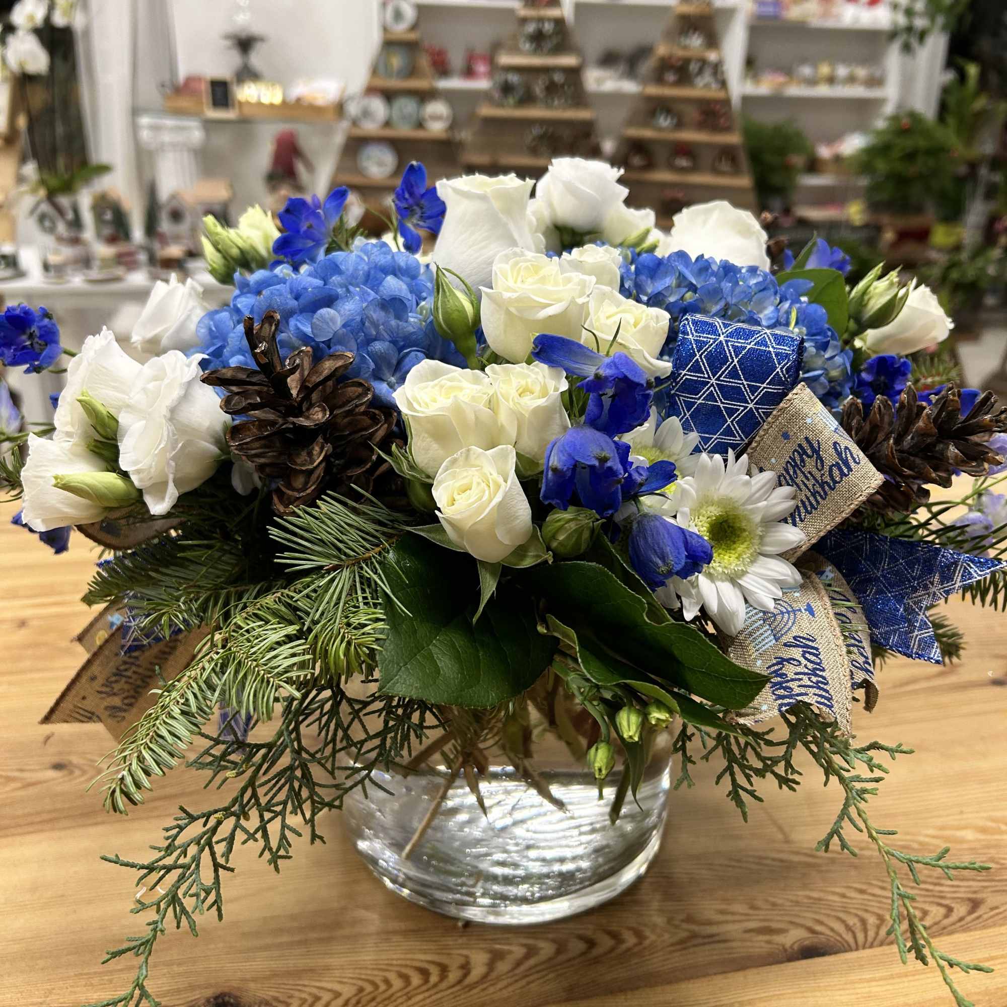 Celebrate the magic of Hanukkah with our enchanting arrangement, Hanukkah Harmony by