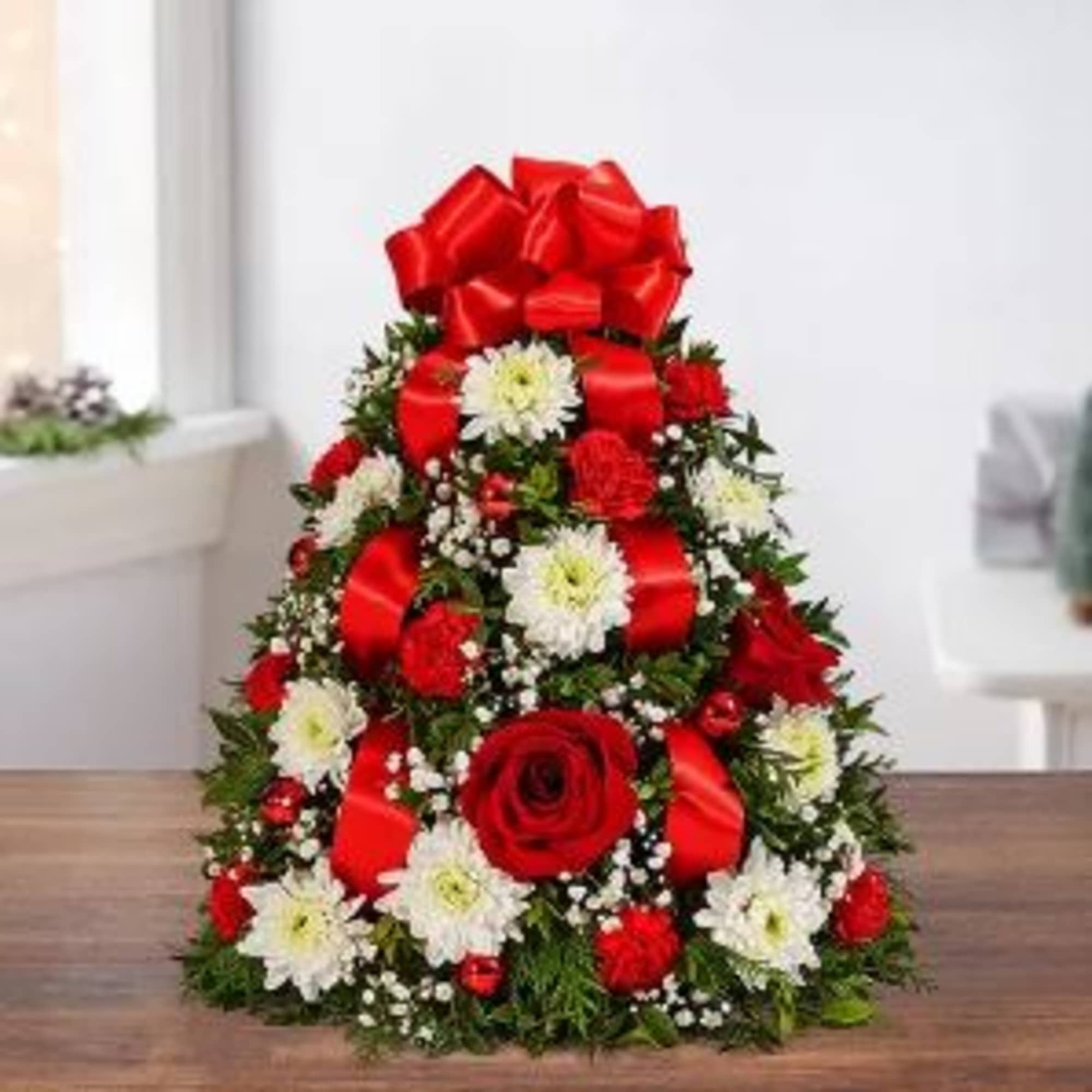 The holiday favorite that started it all! Our flower tree arrangement is