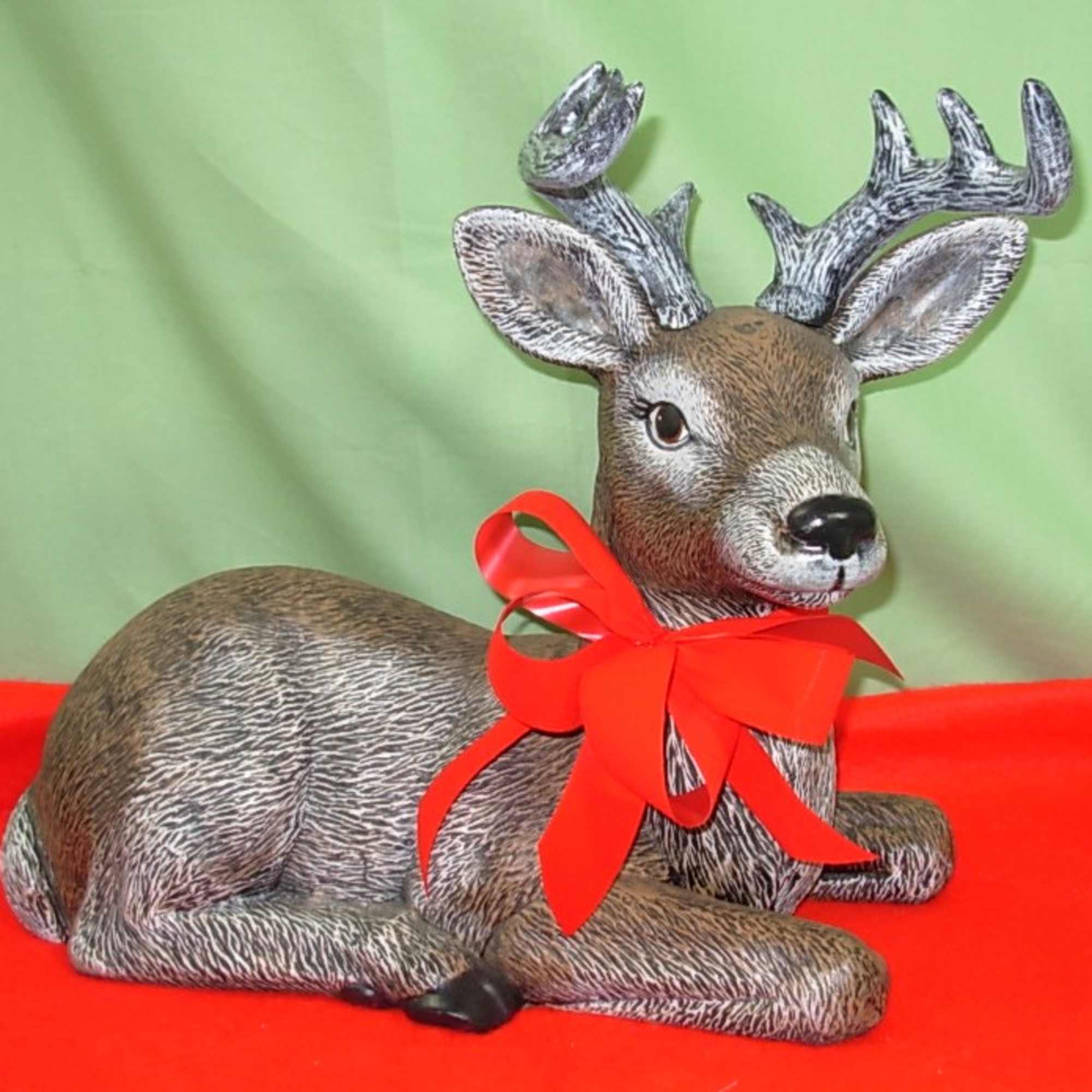 Our BUCK and DOE DEER STATUES  are all decked out with