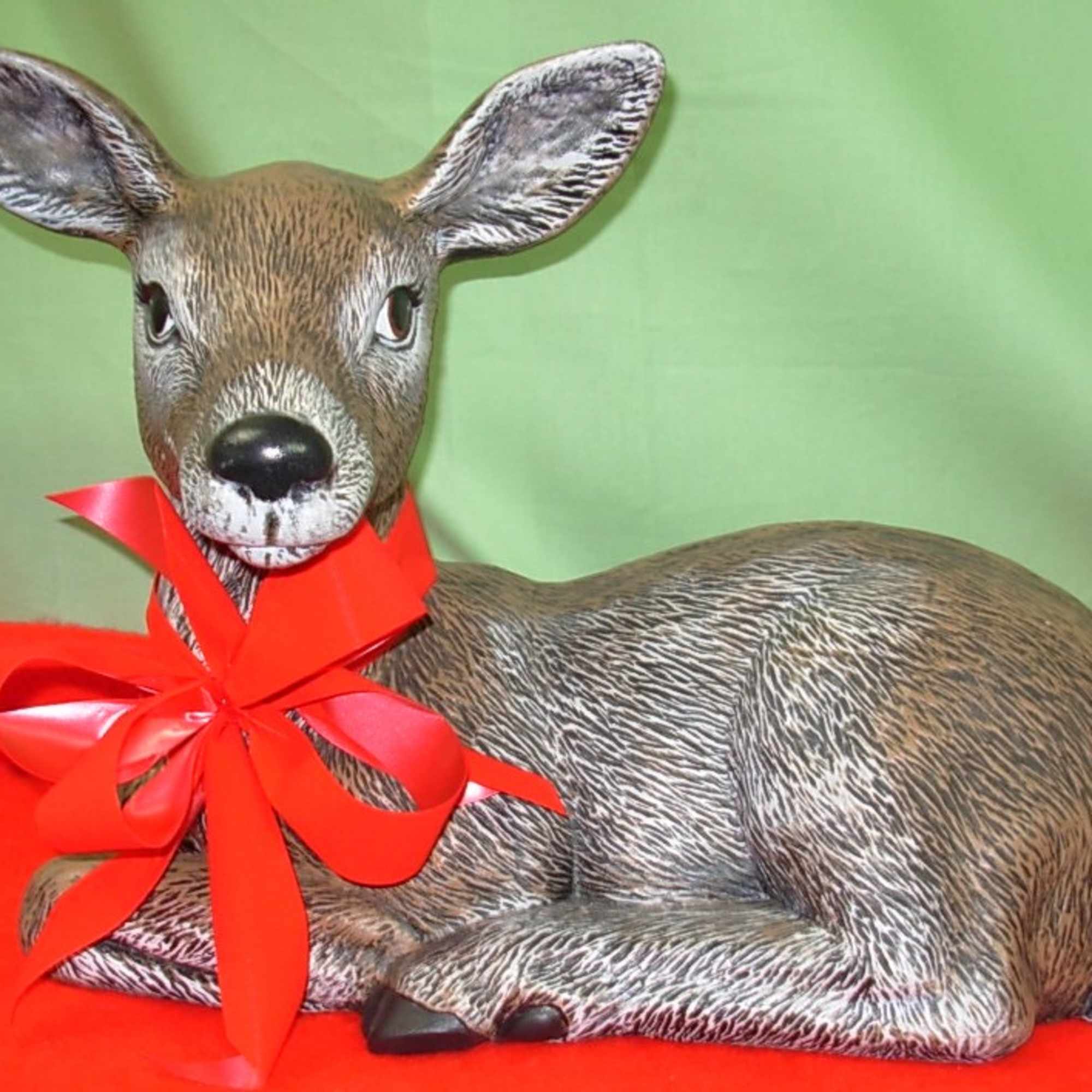 Our BUCK and DOE DEER STATUES  are all decked out with