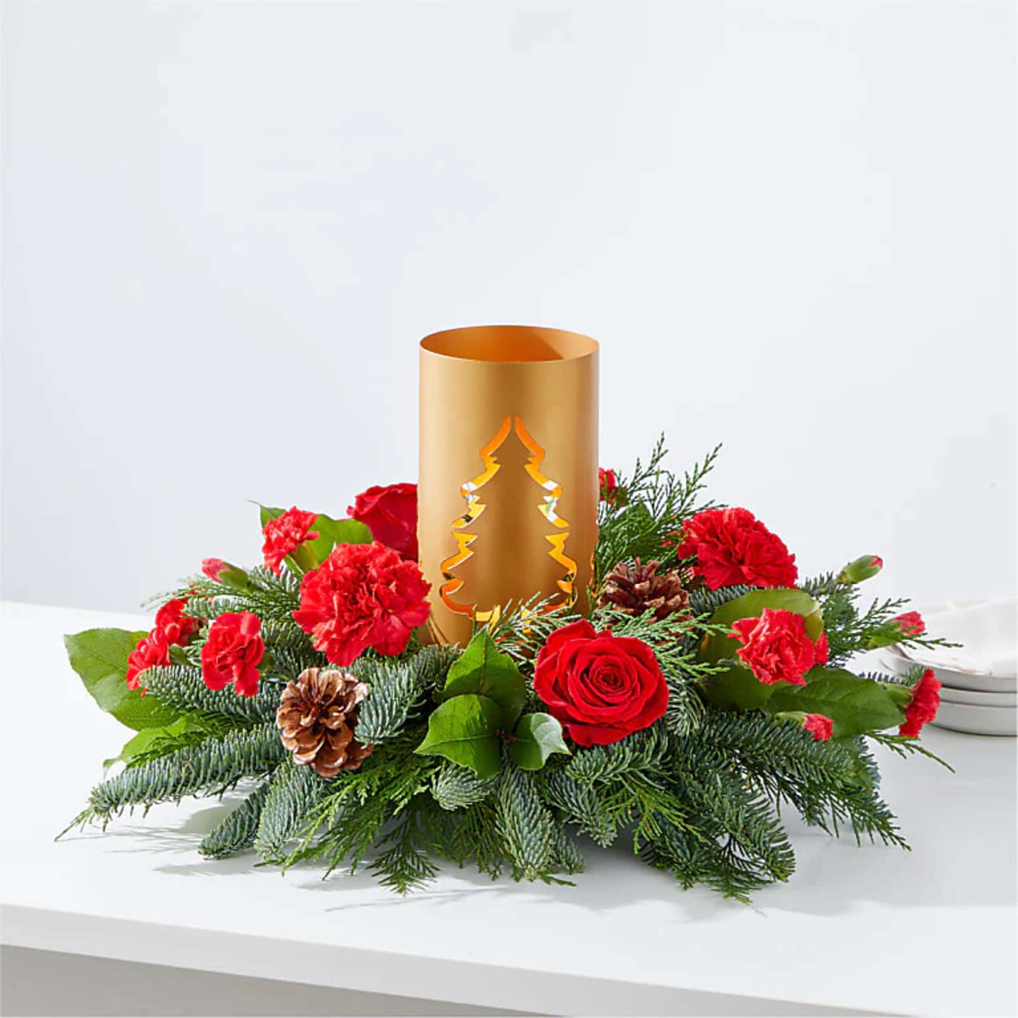Add blustery cheer to any holiday table with this coniferous centerpiece studded