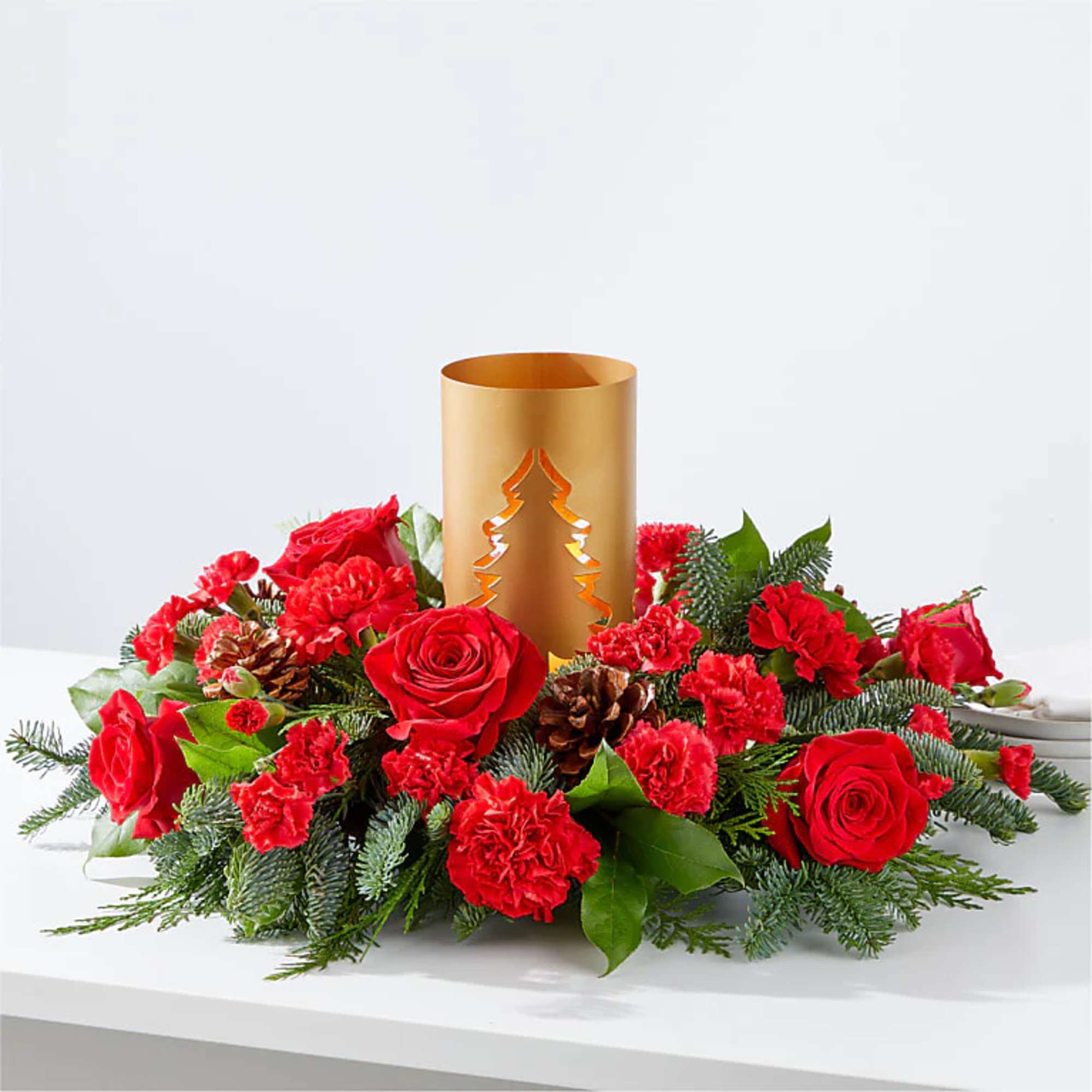 Add blustery cheer to any holiday table with this coniferous centerpiece studded