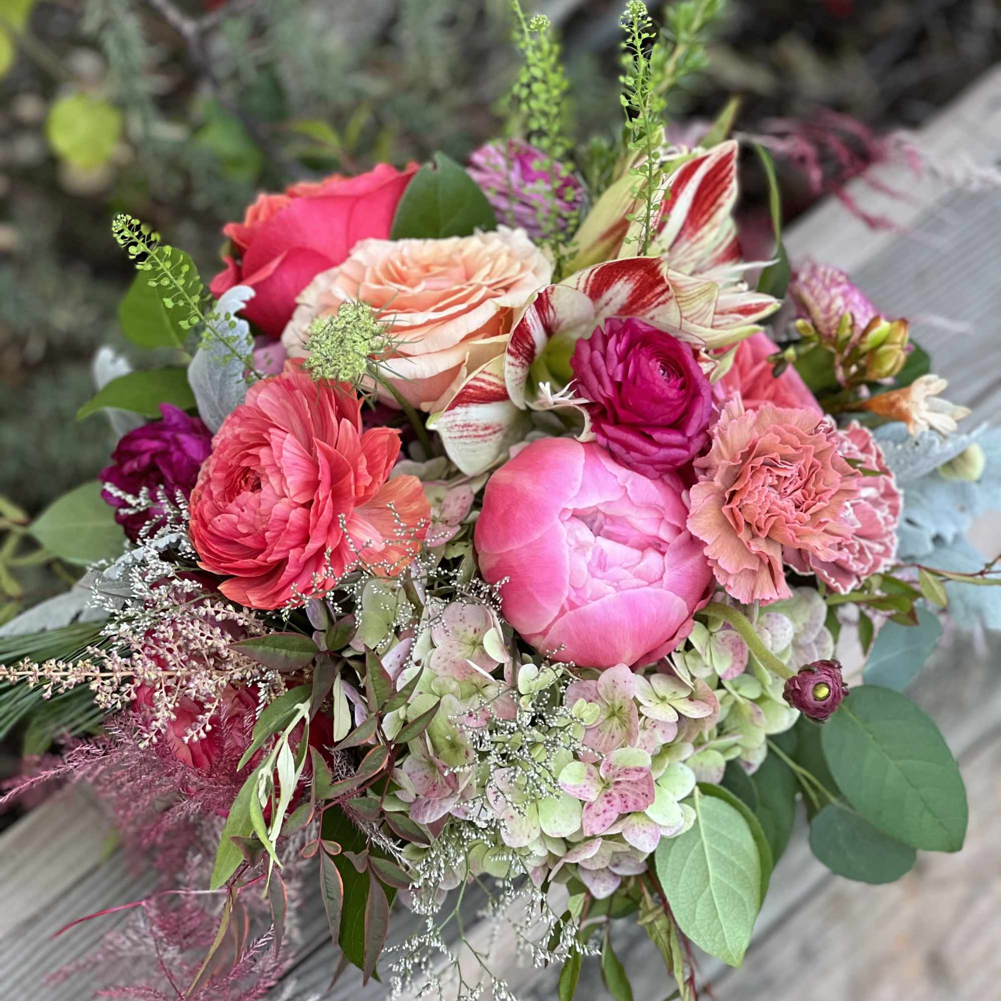 The arrangement showcases he beauty of winter with delicate blooms. It is