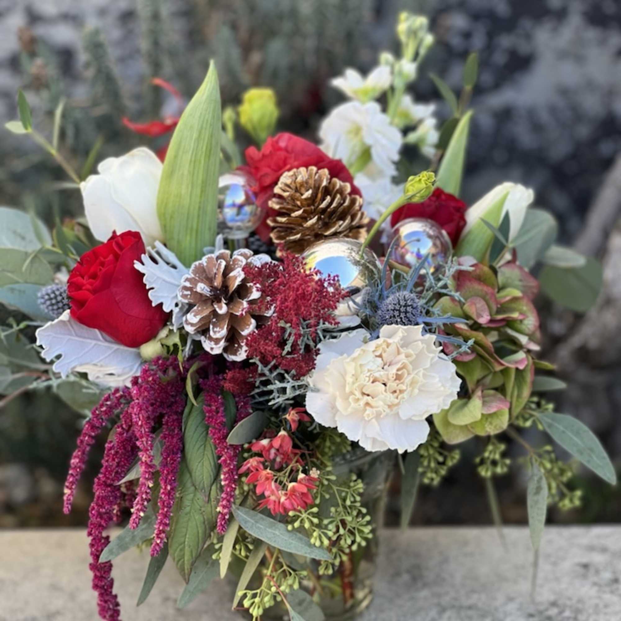 This classic combination of deep red roses and white lisianthus is the