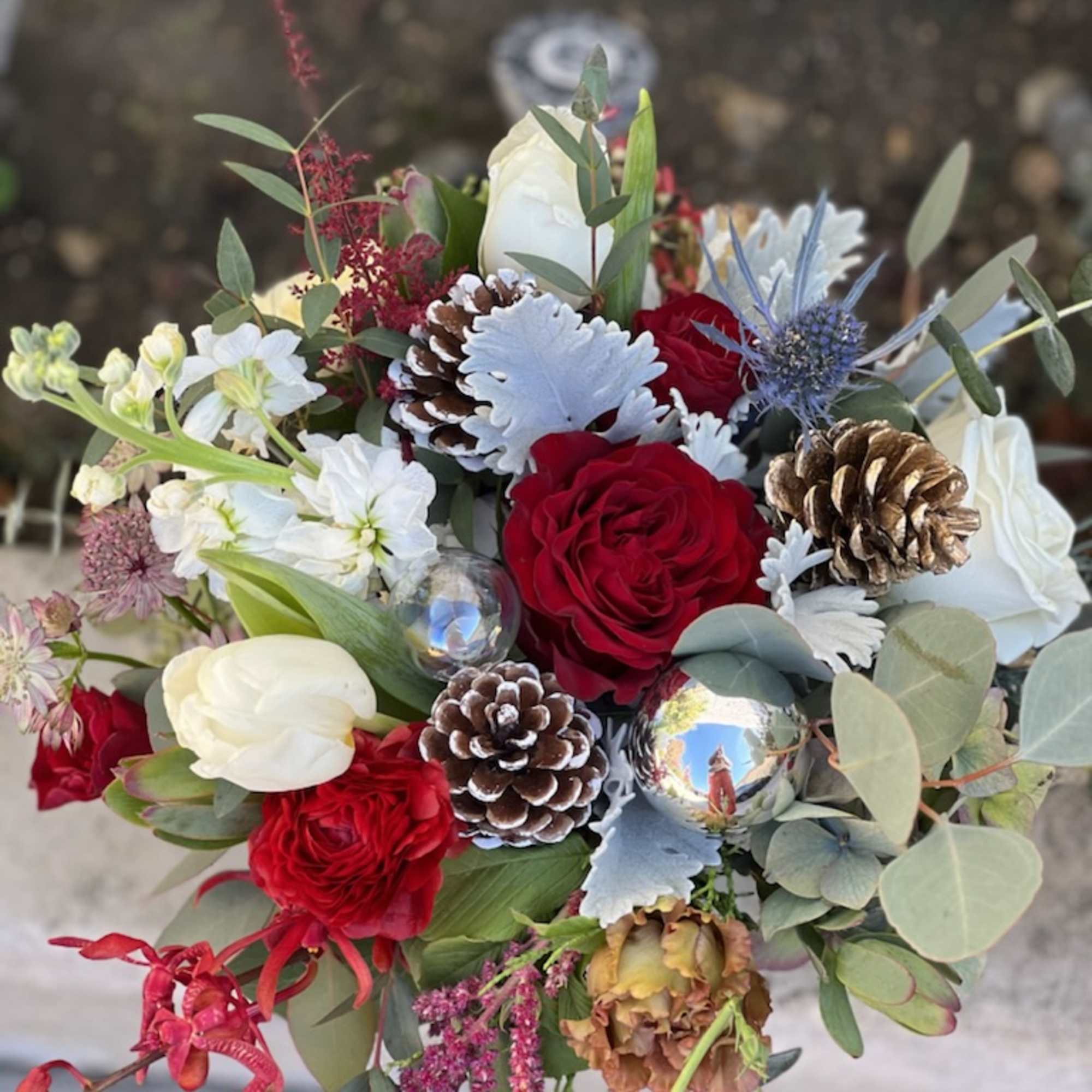 This classic combination of deep red roses and white lisianthus is the