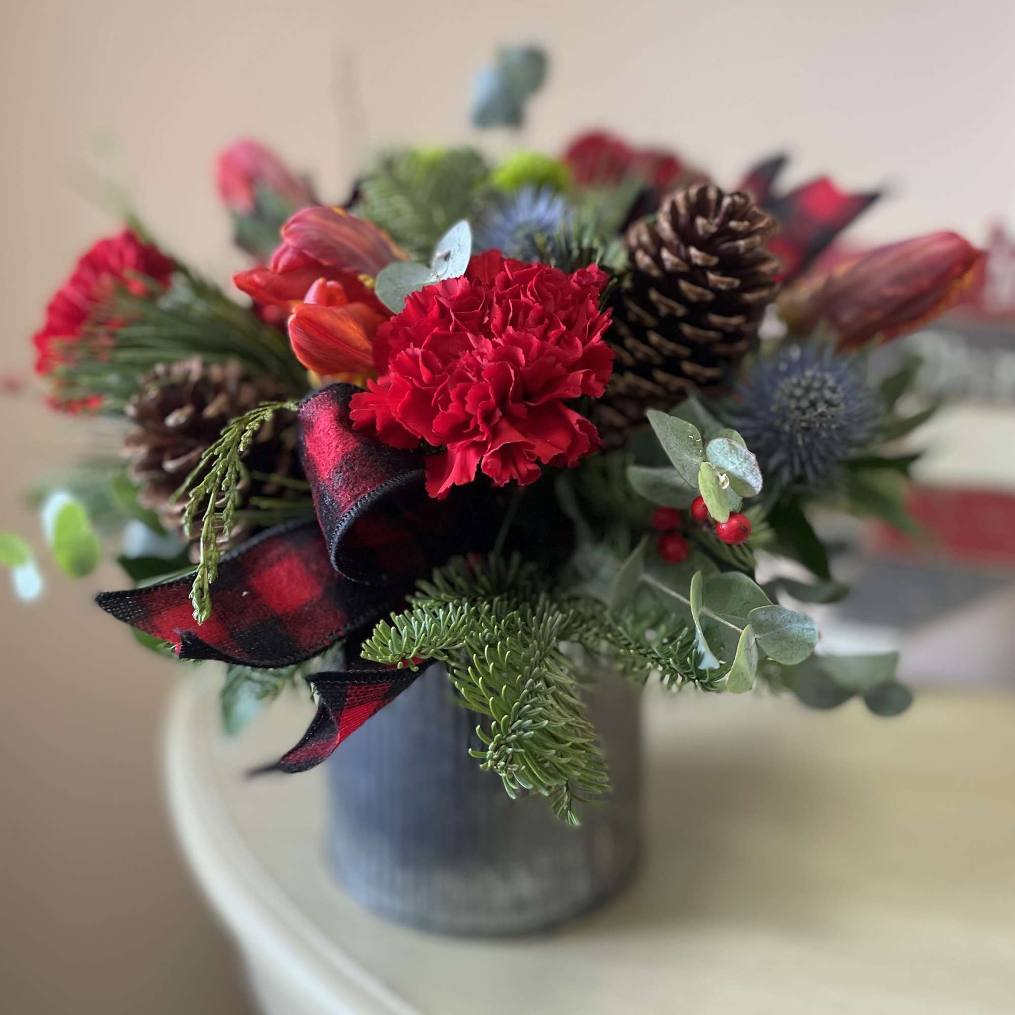 This cozy, winter-inspired arrangement captures the essence of the season with its