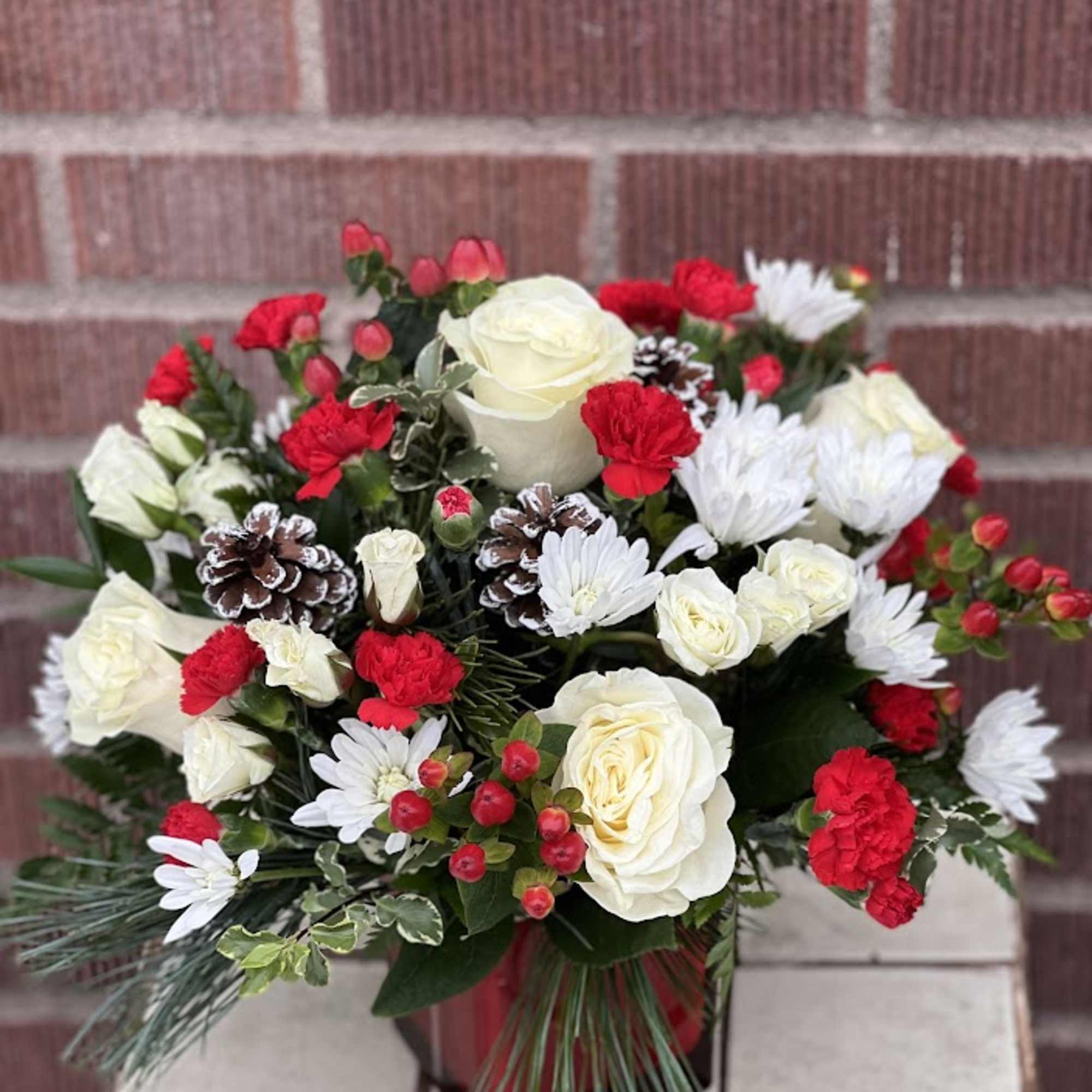 Deliver a winter&#039;s day delight. This sweet bouquet includes red carnations and