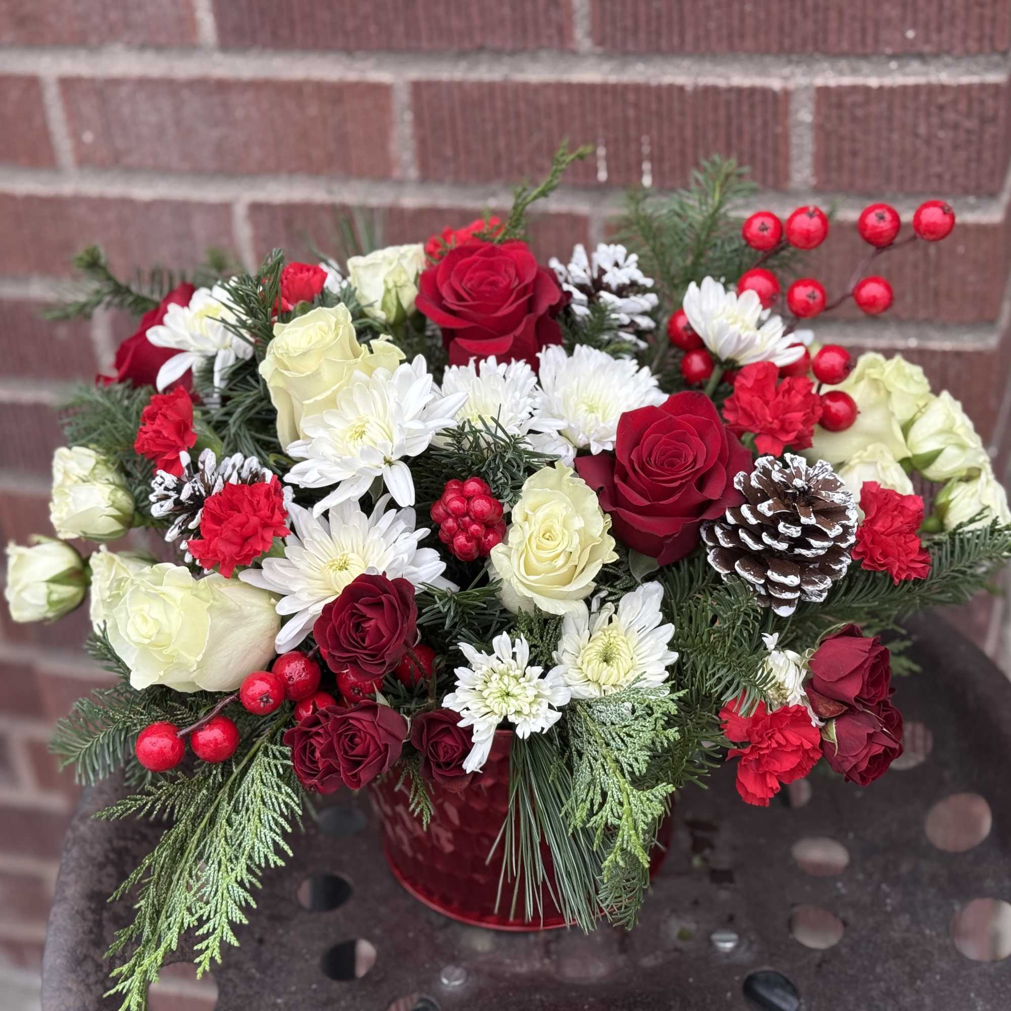 Deliver a winter&#039;s day delight. This sweet bouquet includes red carnations and