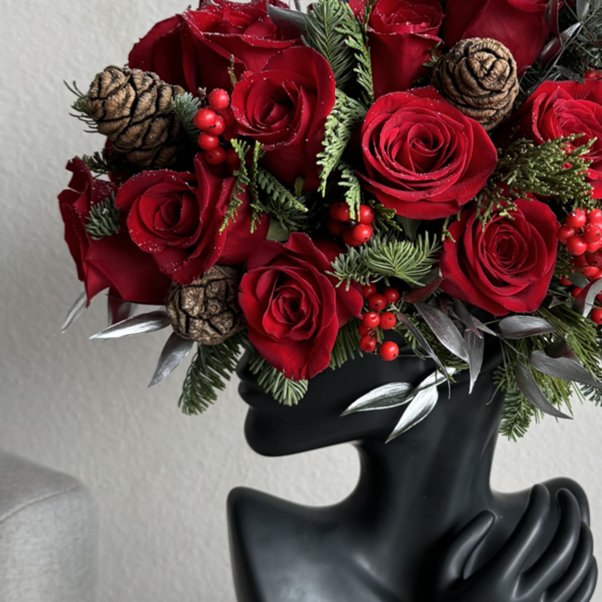 This beautiful arrangement is filled with red roses, hydrangeas and greens to