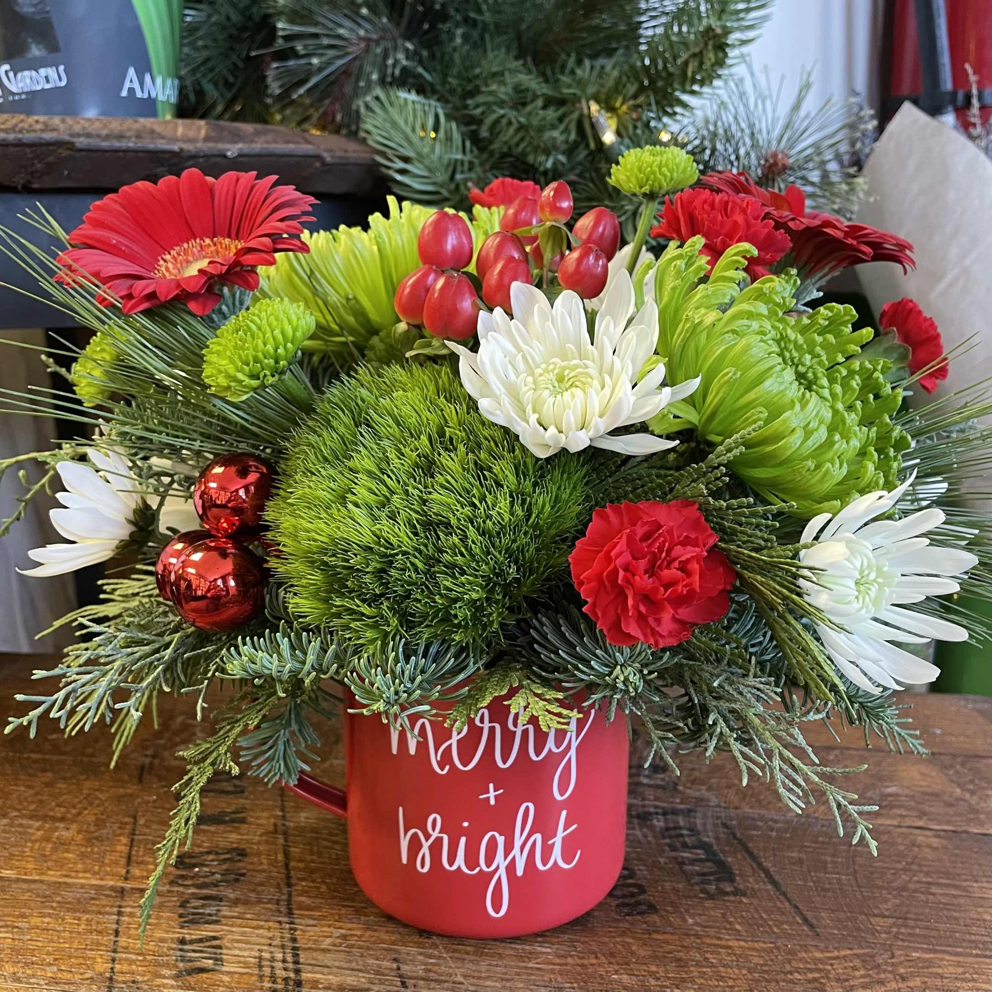 A keepsake metal camp style mug filled with merry &amp; bright flowers!