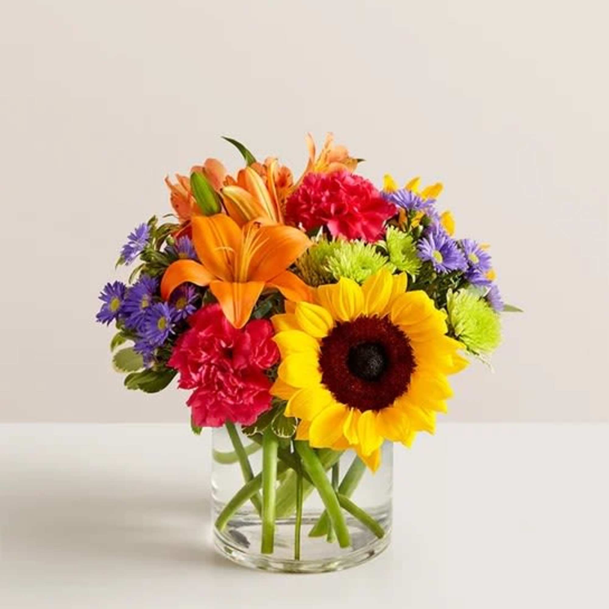Like a warm embrace, our vibrant flower bouquet delivers your sentiments to