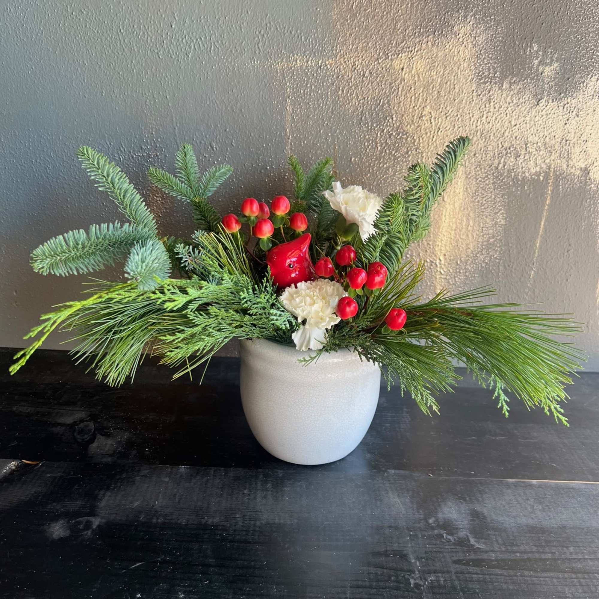 Enjoy this sweet cardinal arrangement throughout your holiday season!