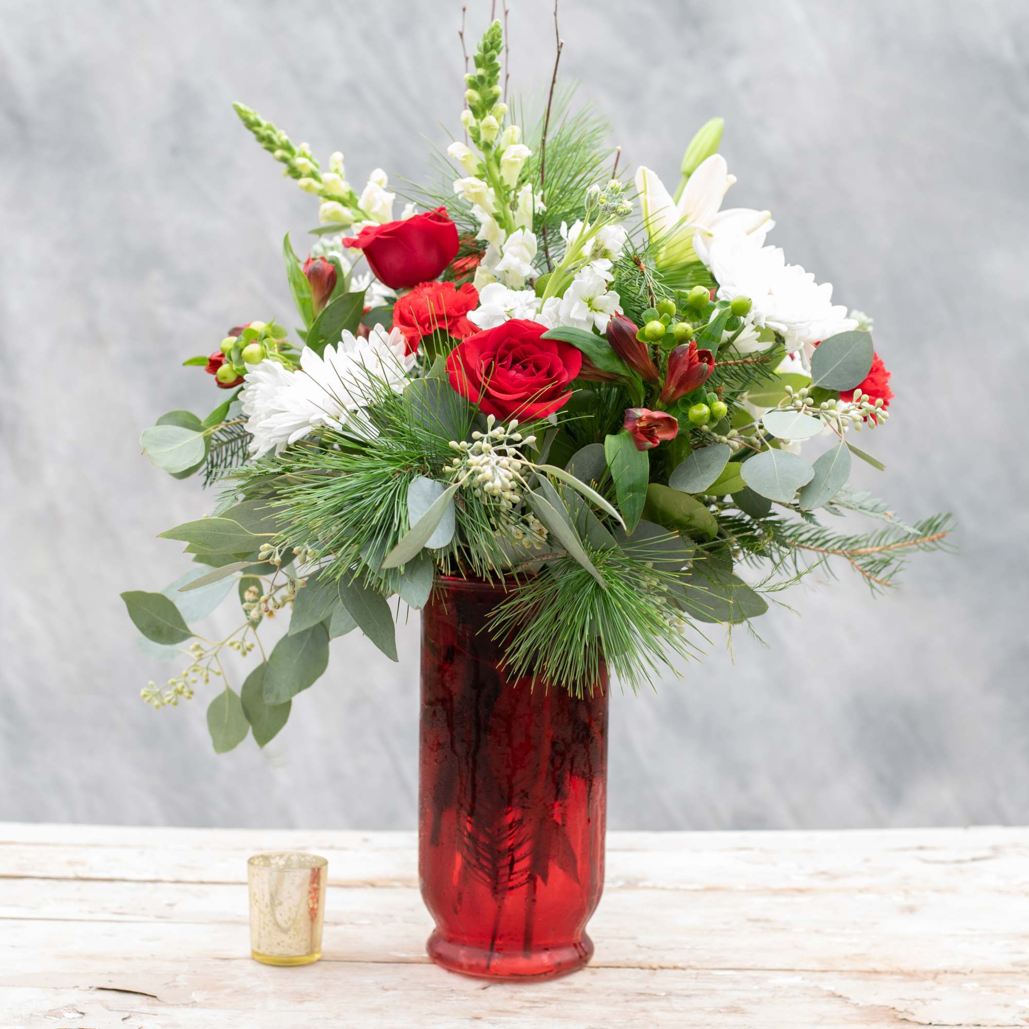 Envision this elegant tall red glass vase on your dining room table