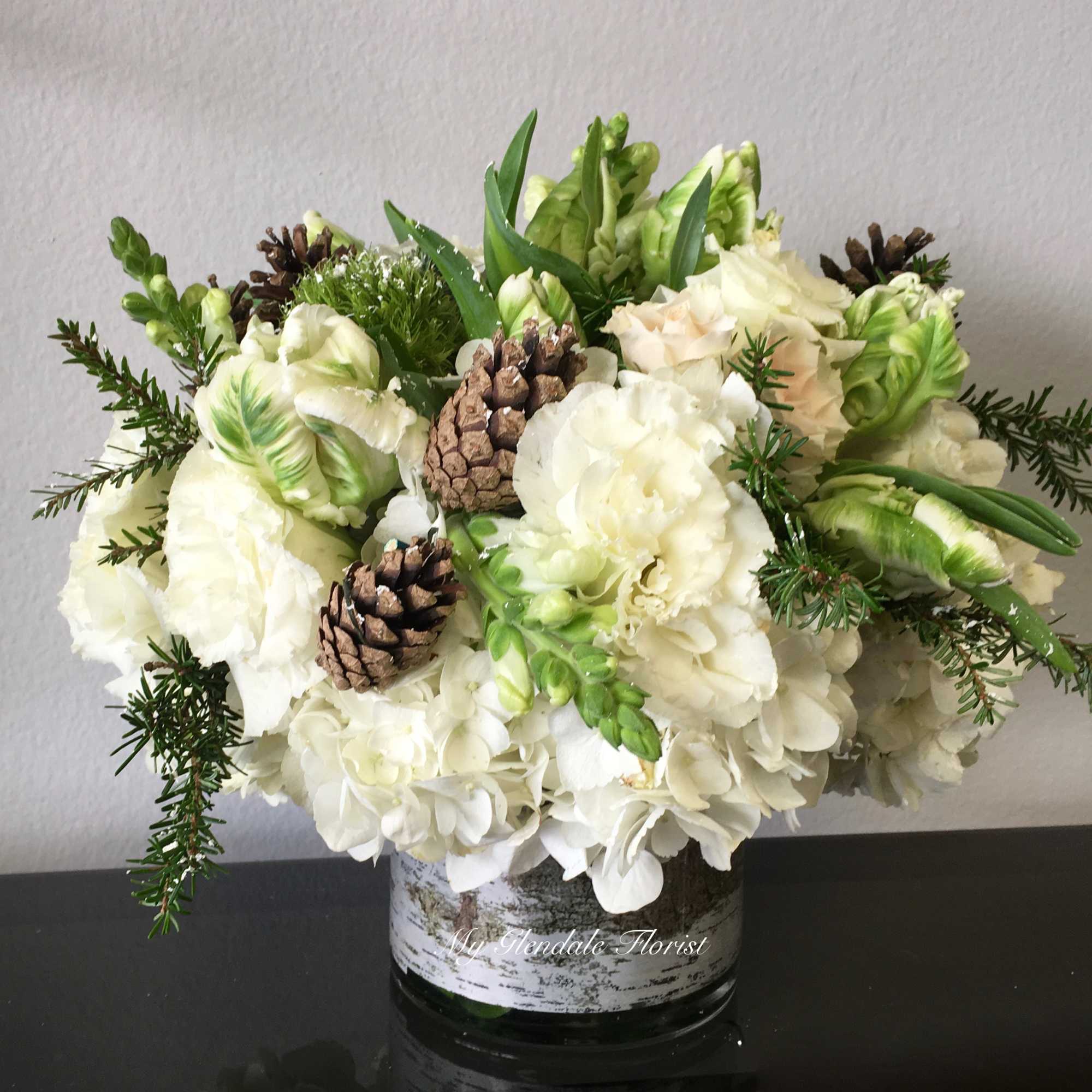 Complete your Christmas decor with an arrangement like this; that includes pinecones