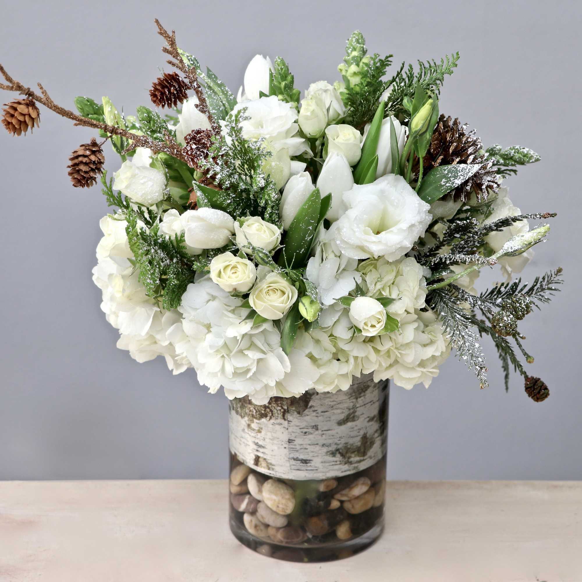 Complete your Christmas decor with an arrangement like this; that includes pinecones