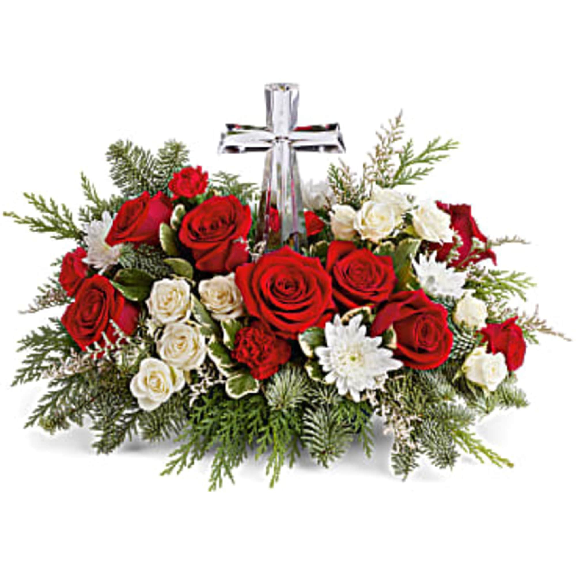 The crystal cross is nestled elegantly among red and white blooms, this