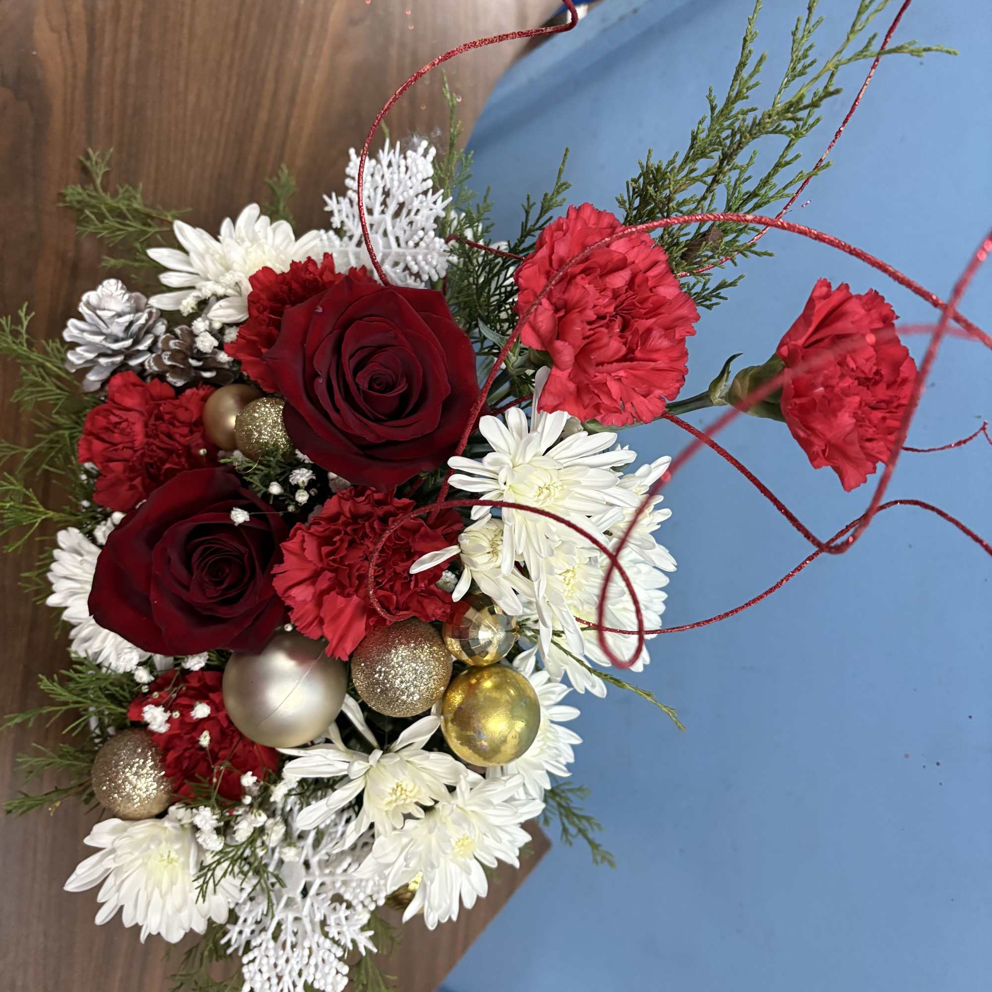 Over the top Christmas arrangement designed in a unique keepsake sled that