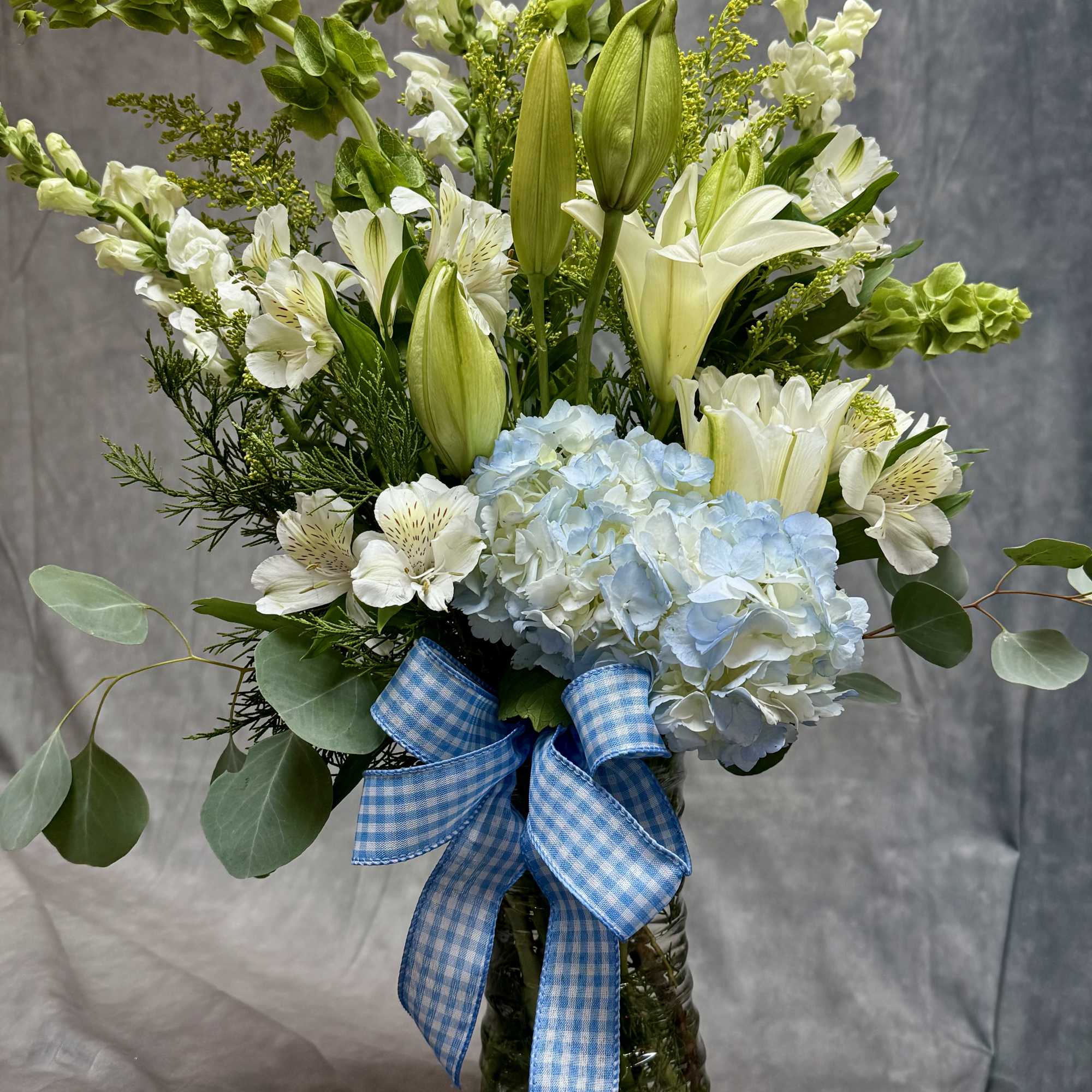 introducing Our New Design Blue Hue, beautifully arranged with lilies, hydrangea, delphinium