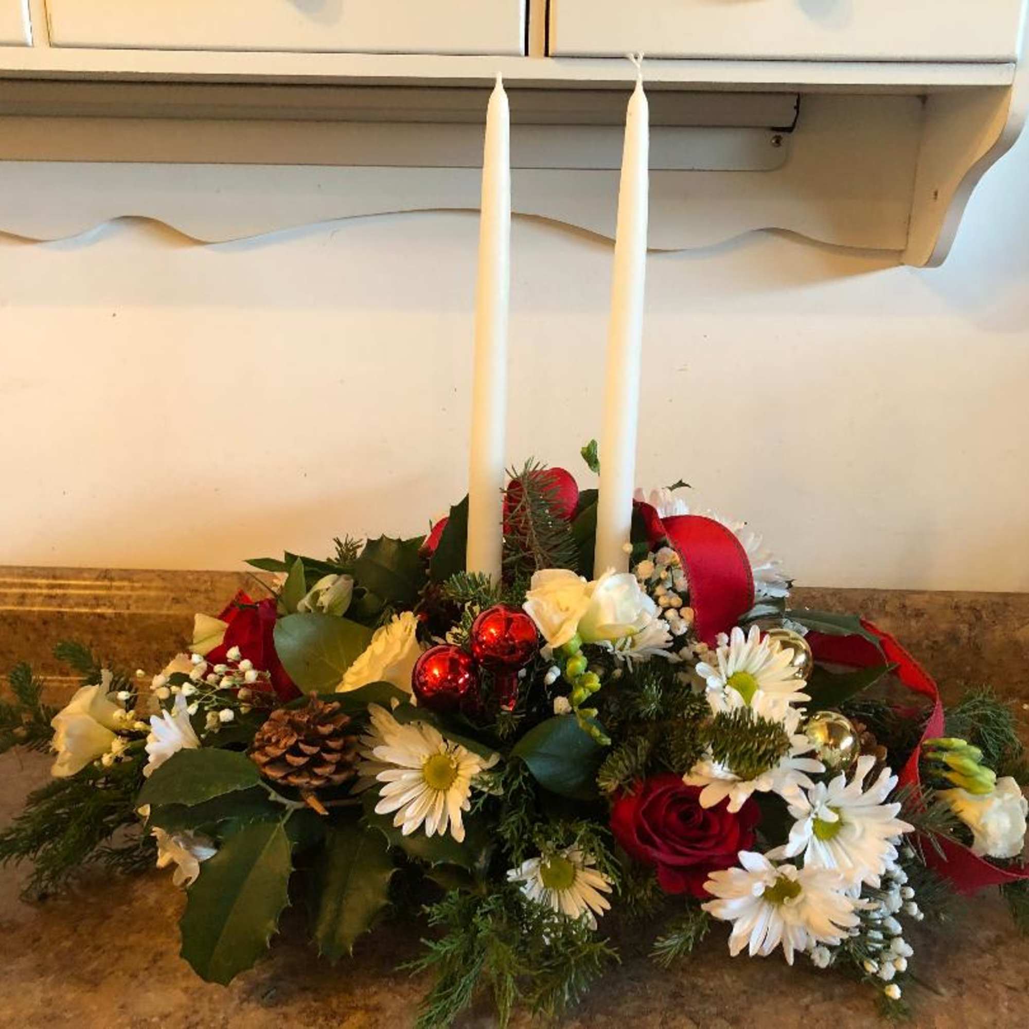 A beautiful assortment of red and white flowers such as alstroemeria, roses
