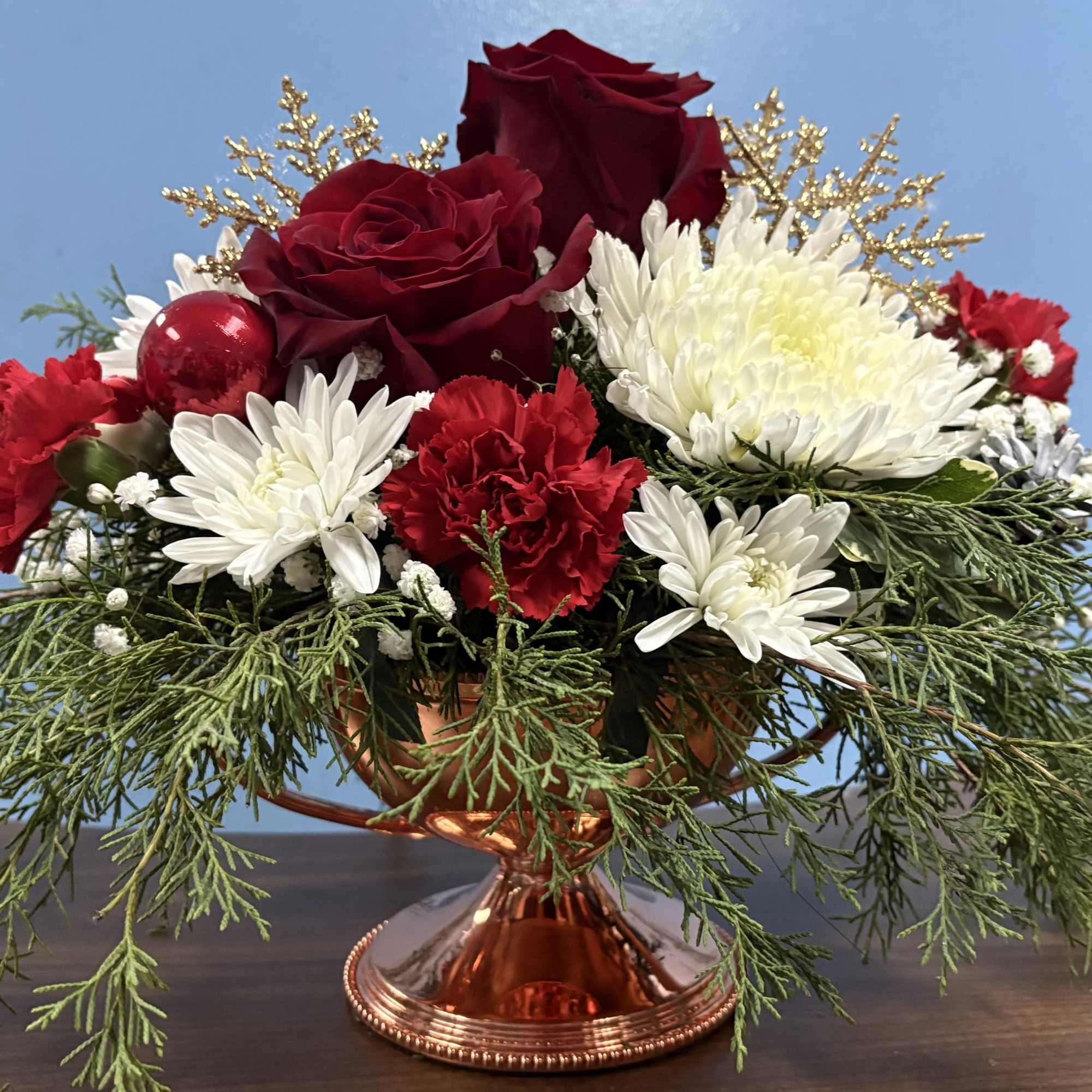 Our Sassy Brassy Christmas arrangement would be the perfect gift to someone