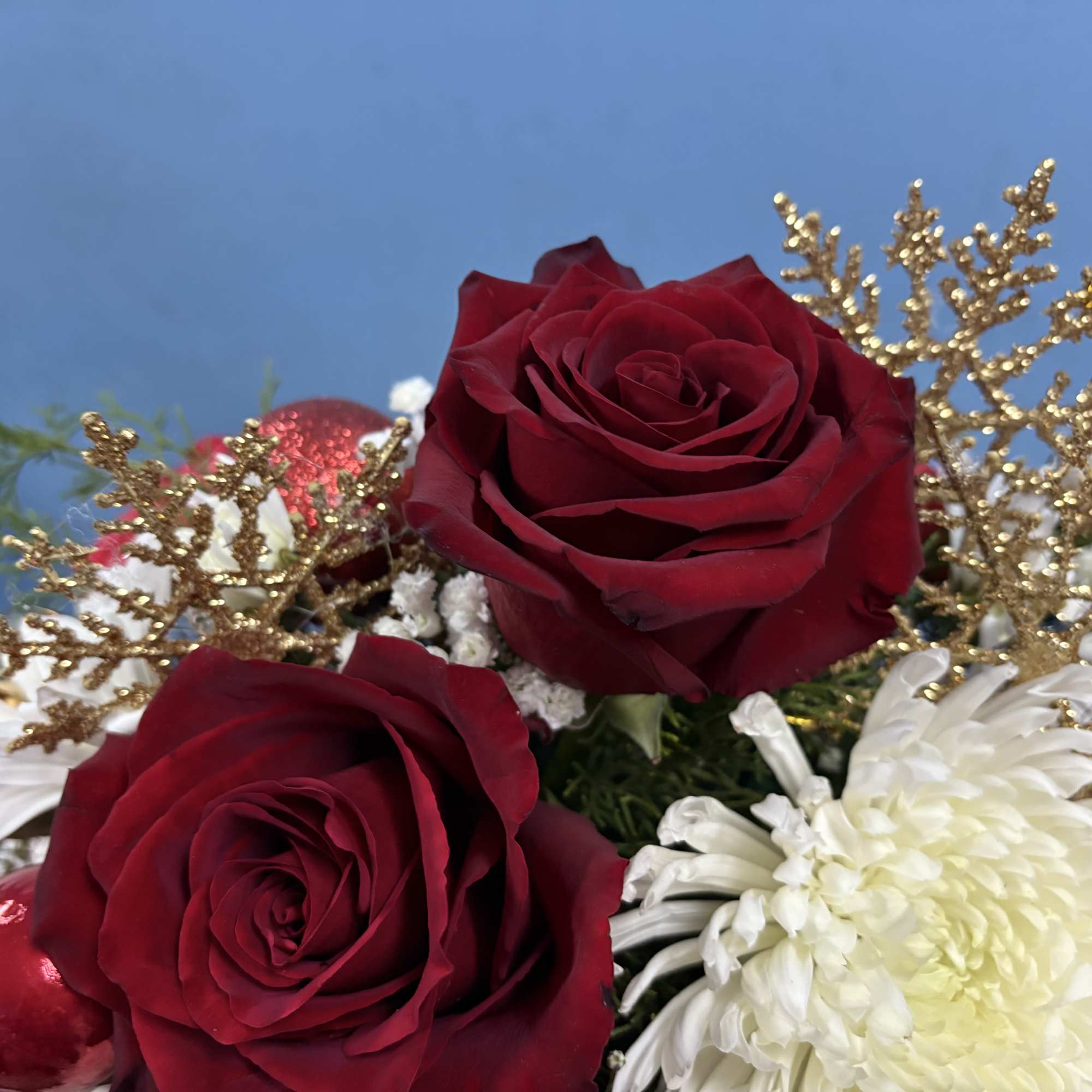 Our Sassy Brassy Christmas arrangement would be the perfect gift to someone