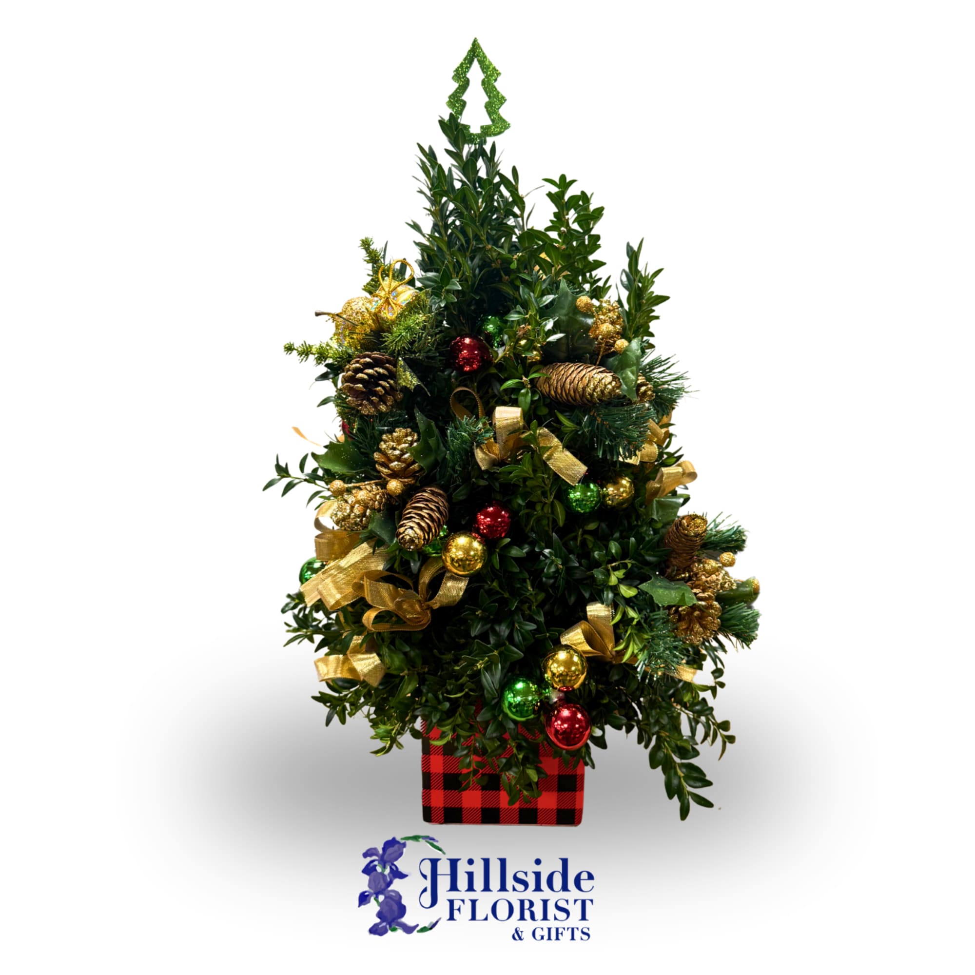 All trees are uniquely decorated. Boxwood greens arranged in a classic tree
