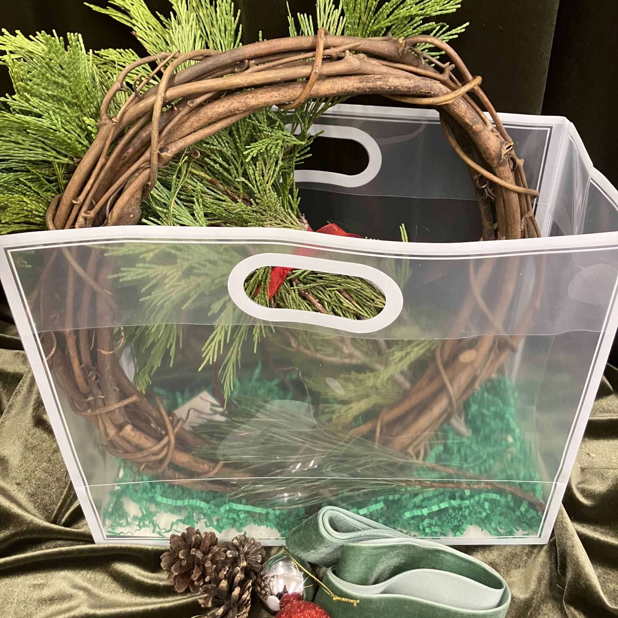 Stay inside where it&rsquo;s warm and create a cute grapevine evergreen wreath!