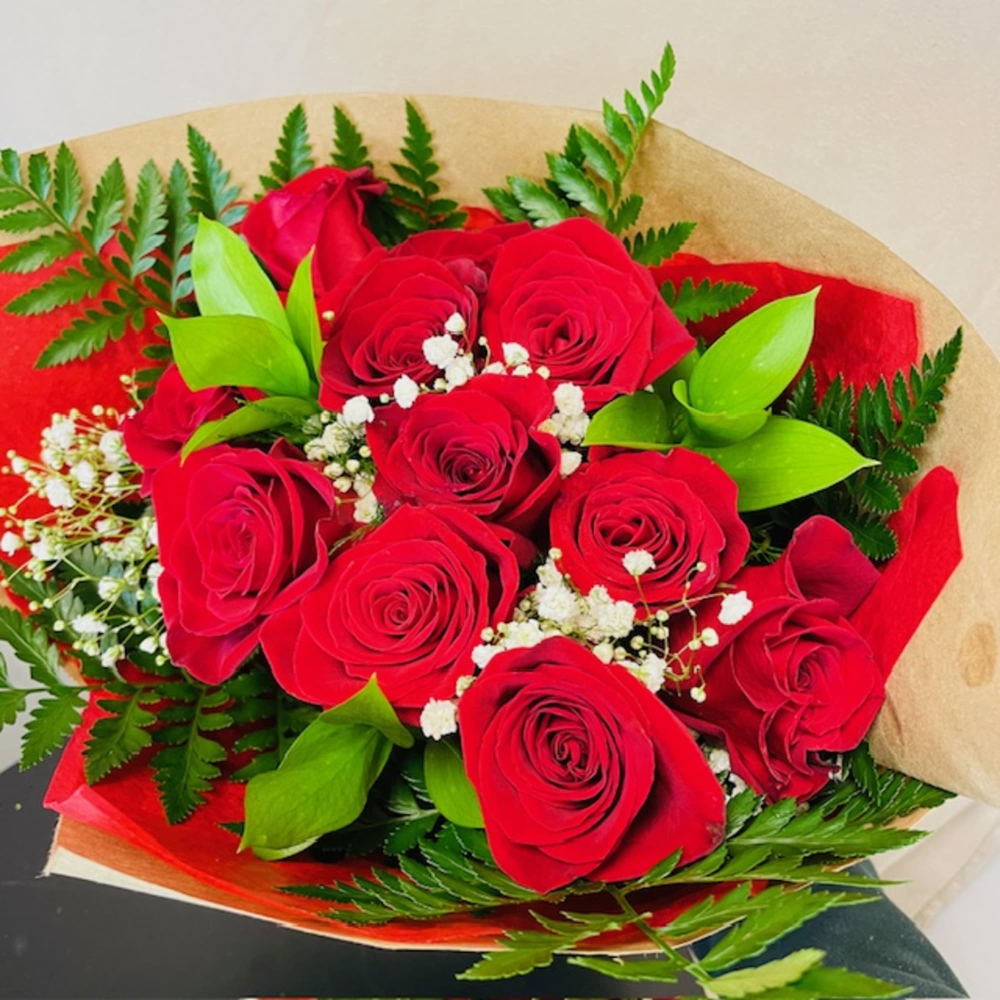 Dozen Wrapped Premium Ecuadorian Red Roses with filler and Greenery

Indulge in the