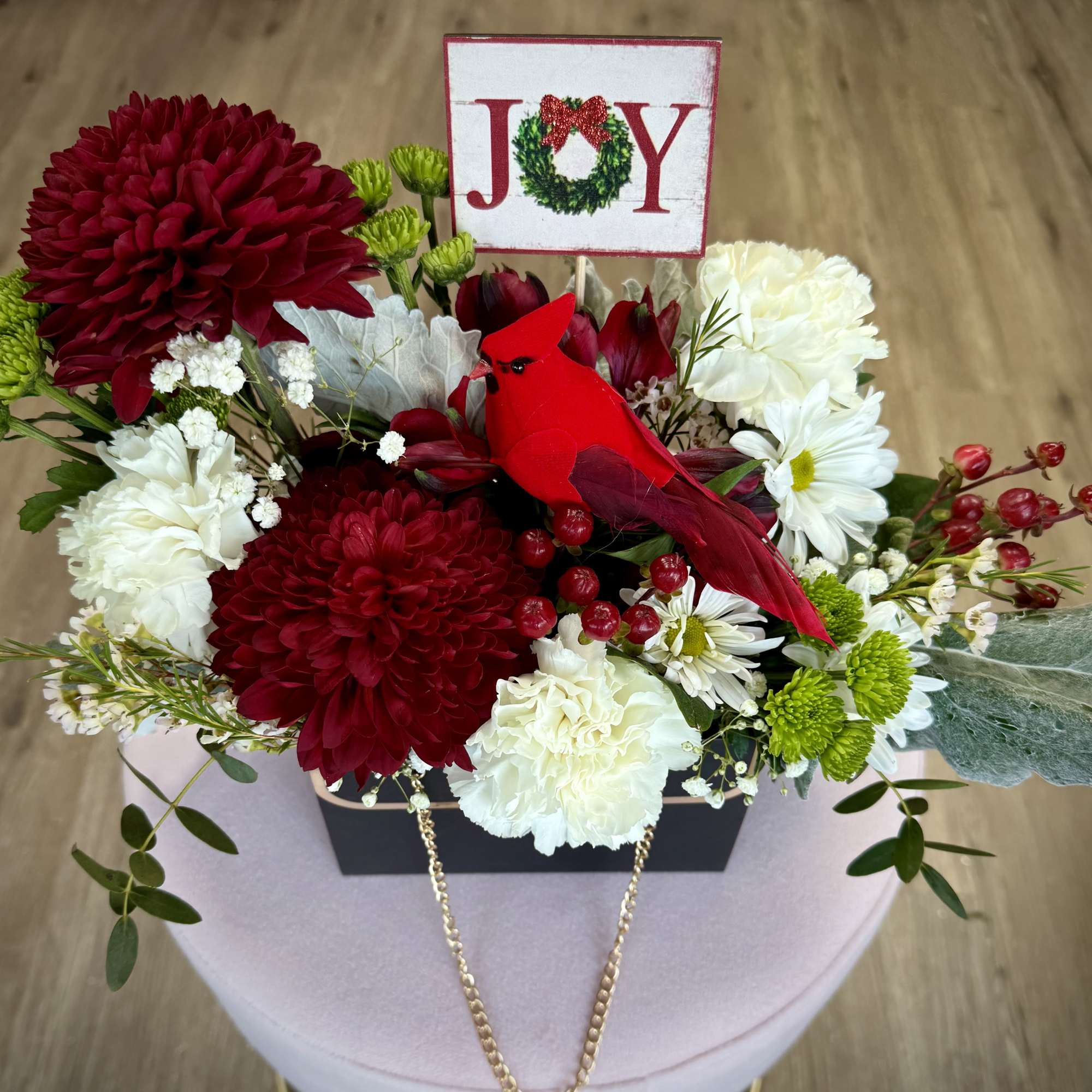Bring holiday charm to your space with our Christmas arrangement, styled in