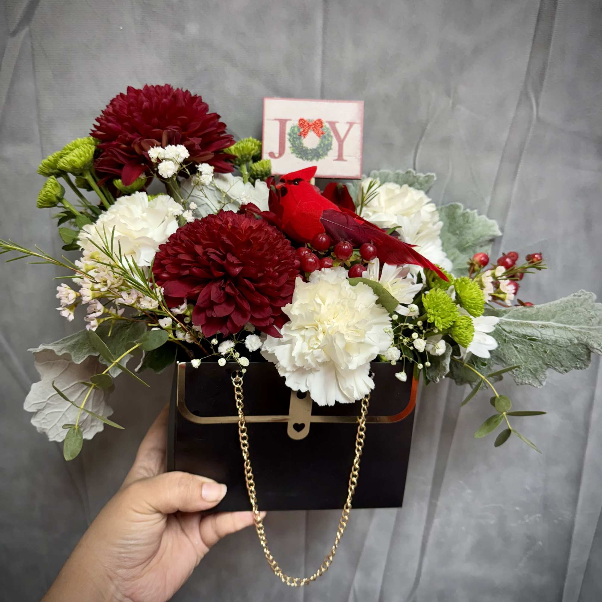Bring holiday charm to your space with our Christmas arrangement, styled in