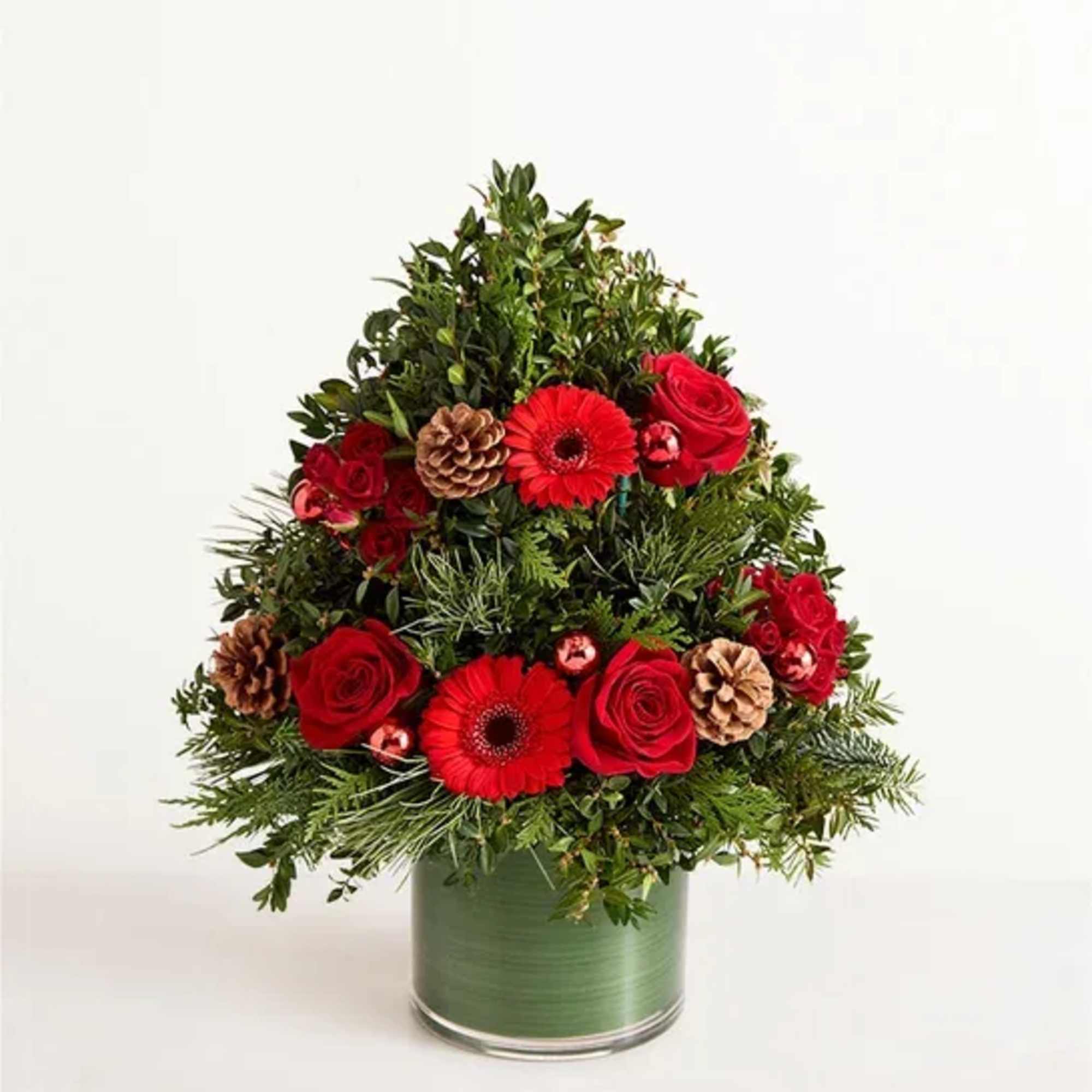 EXCLUSIVE Share the radiant wonder of Christmas. Our elegant evergreen tree arrangement