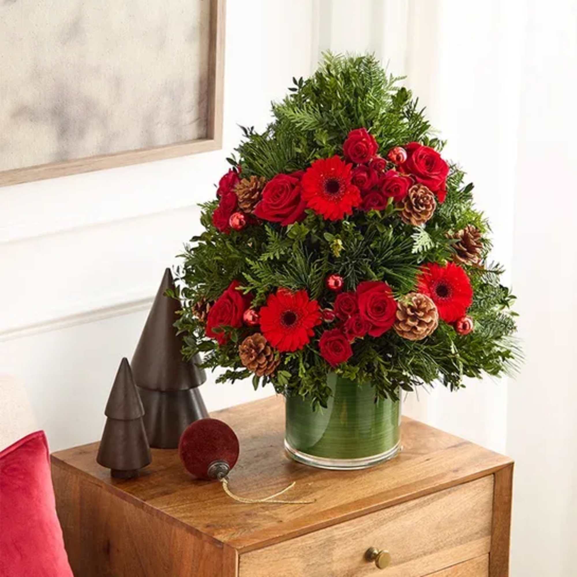 EXCLUSIVE Share the radiant wonder of Christmas. Our elegant evergreen tree arrangement