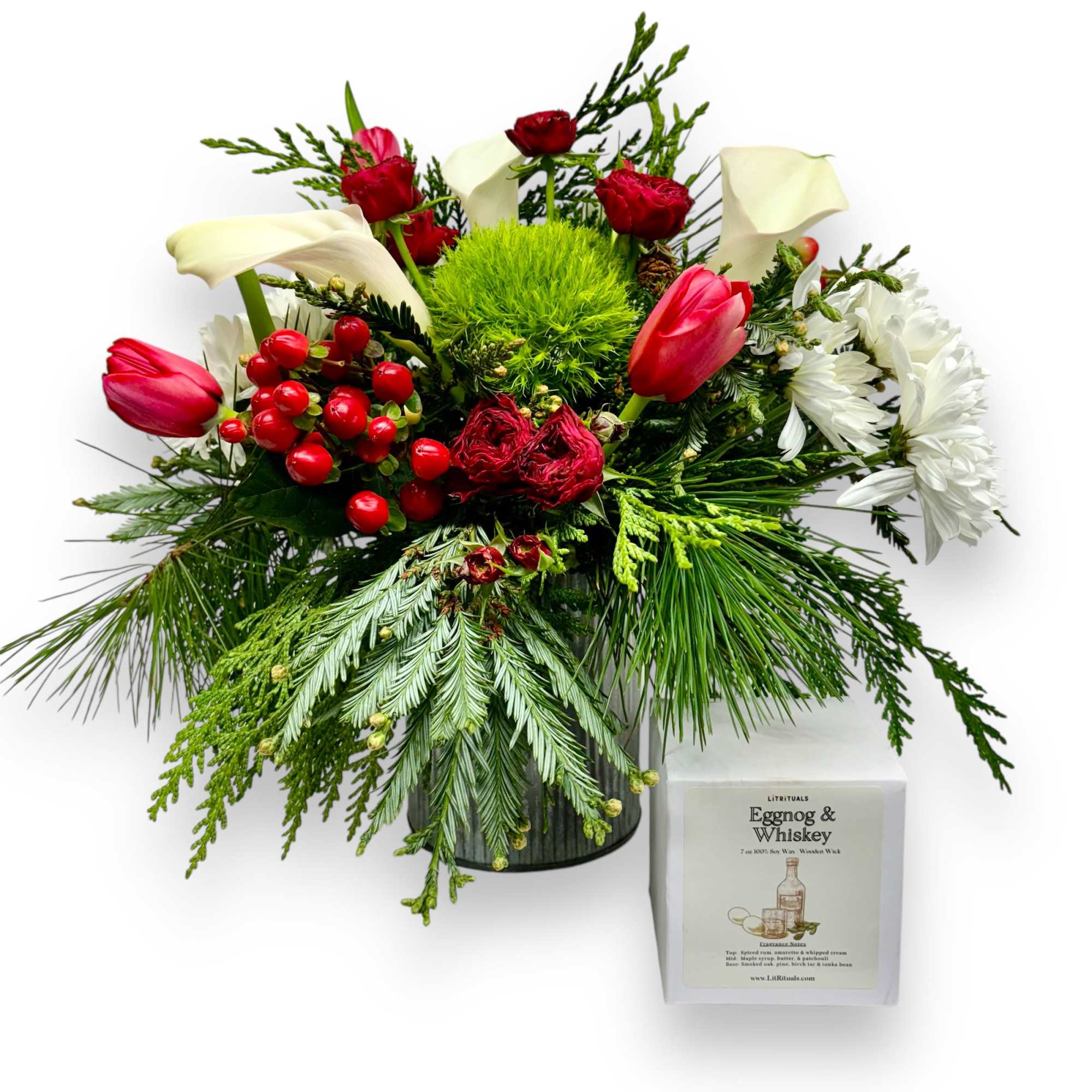 A beautiful arrangement of holiday foliage and winter flowers. Accompanied with a