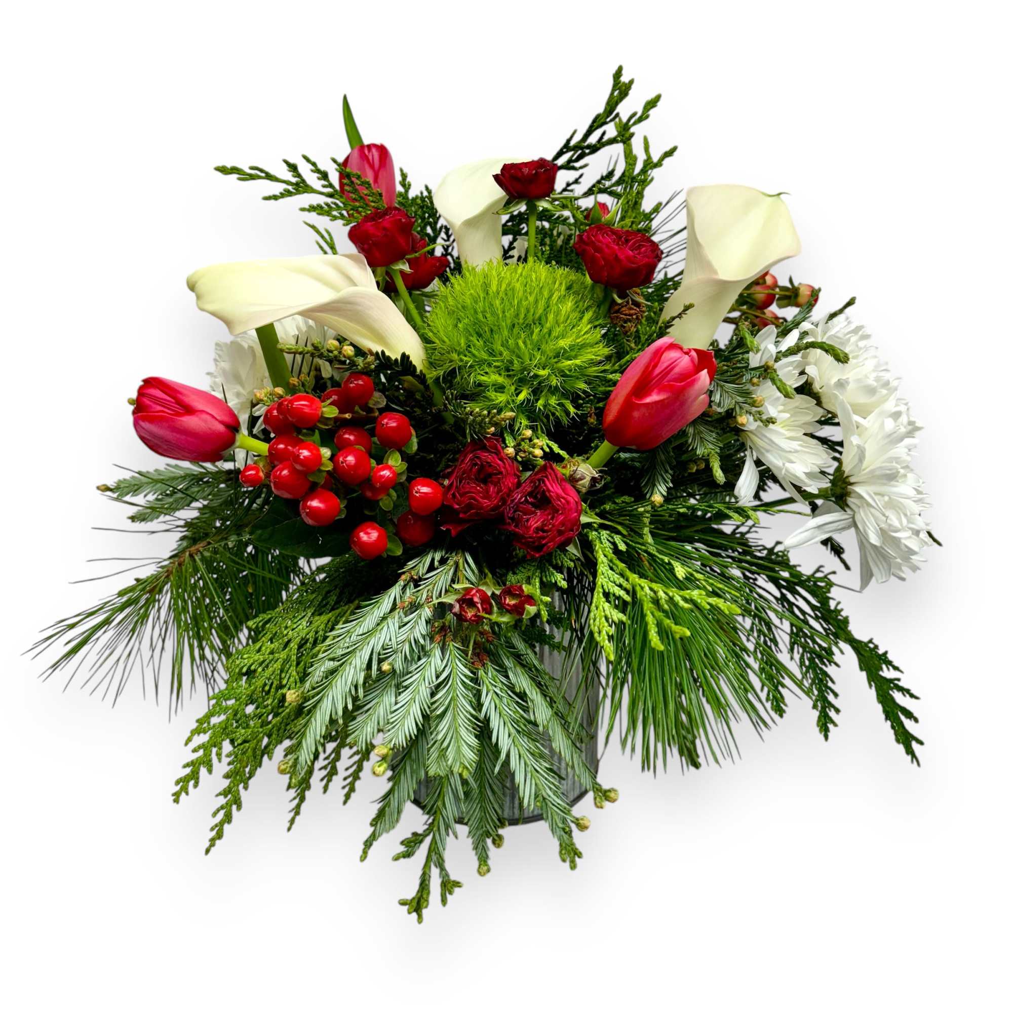 A beautiful arrangement of holiday foliage and winter flowers. Accompanied with a