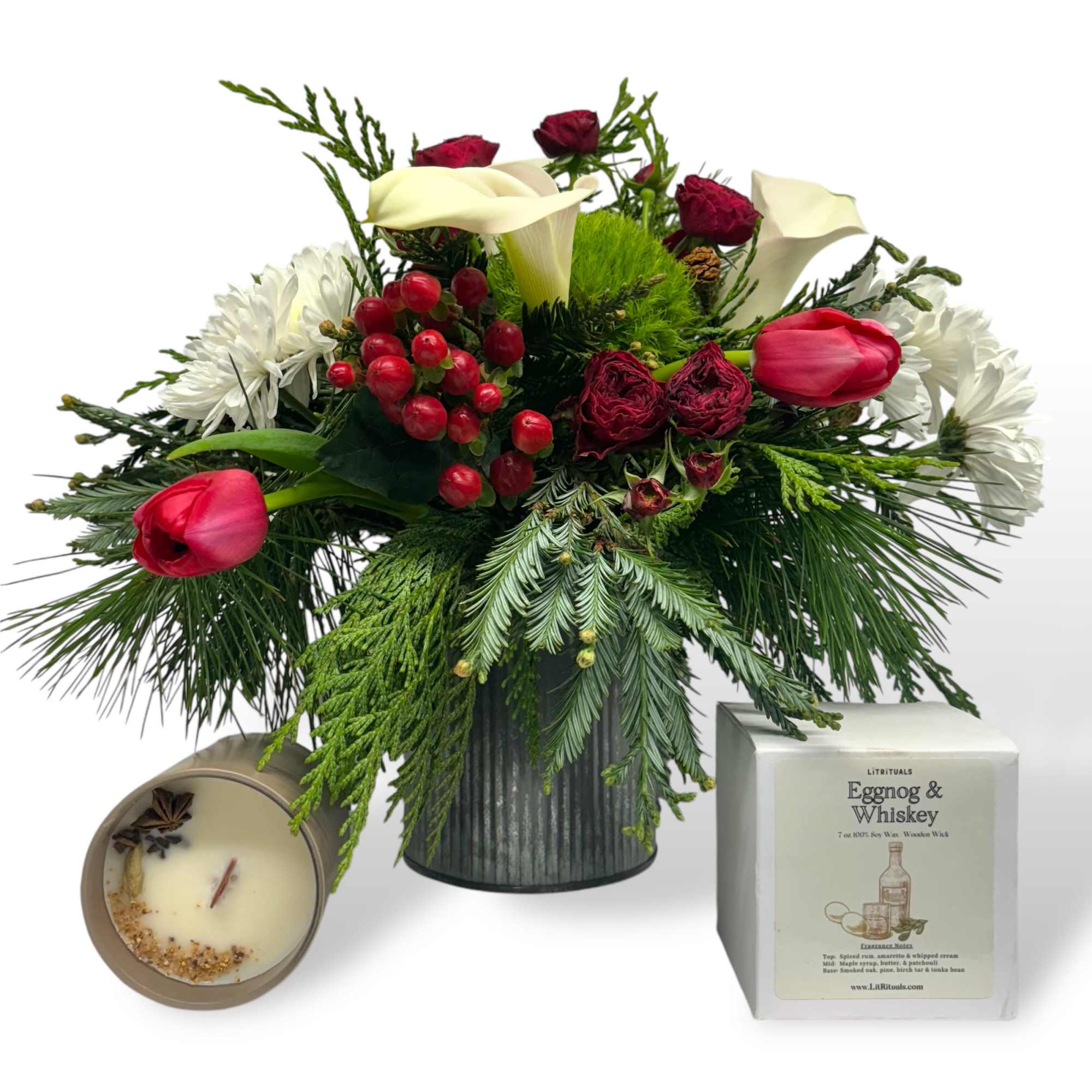 A beautiful arrangement of holiday foliage and winter flowers. Accompanied with a
