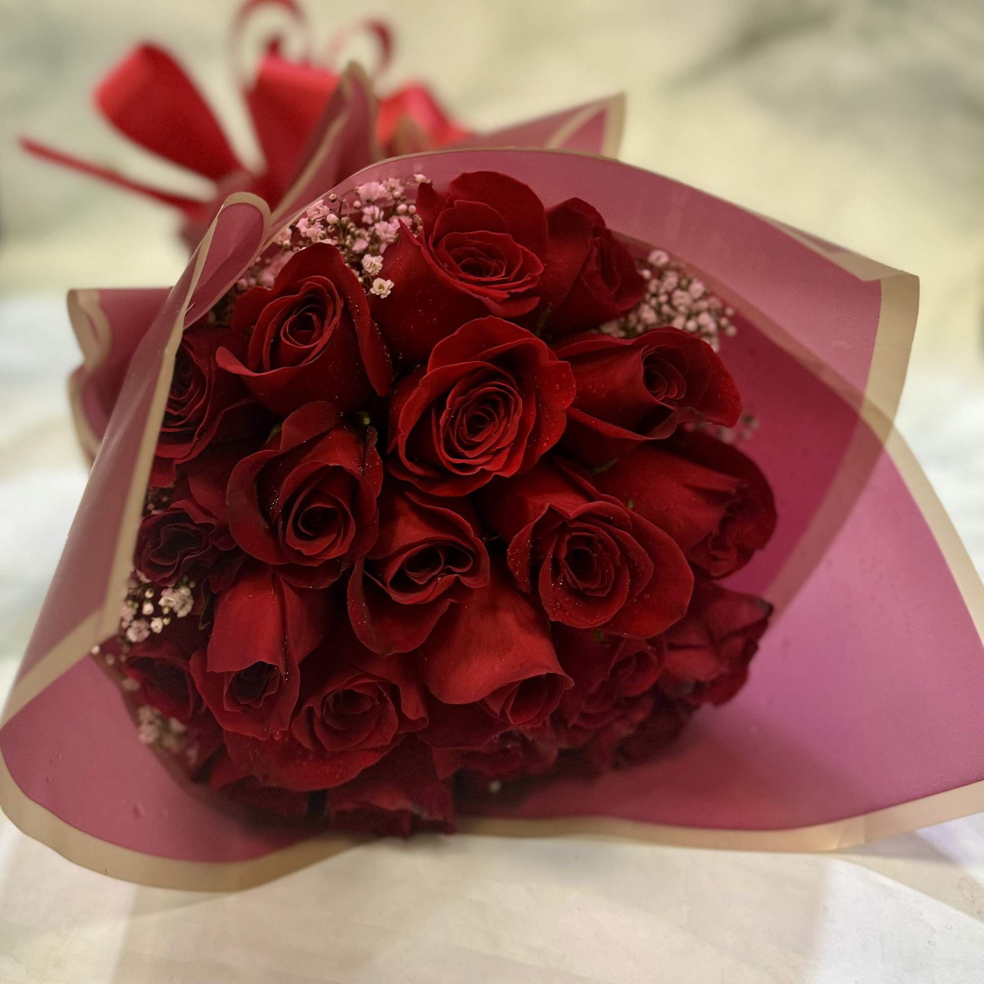 This bouquet includes 24 classy red roses wrapped in special waterproof floral
