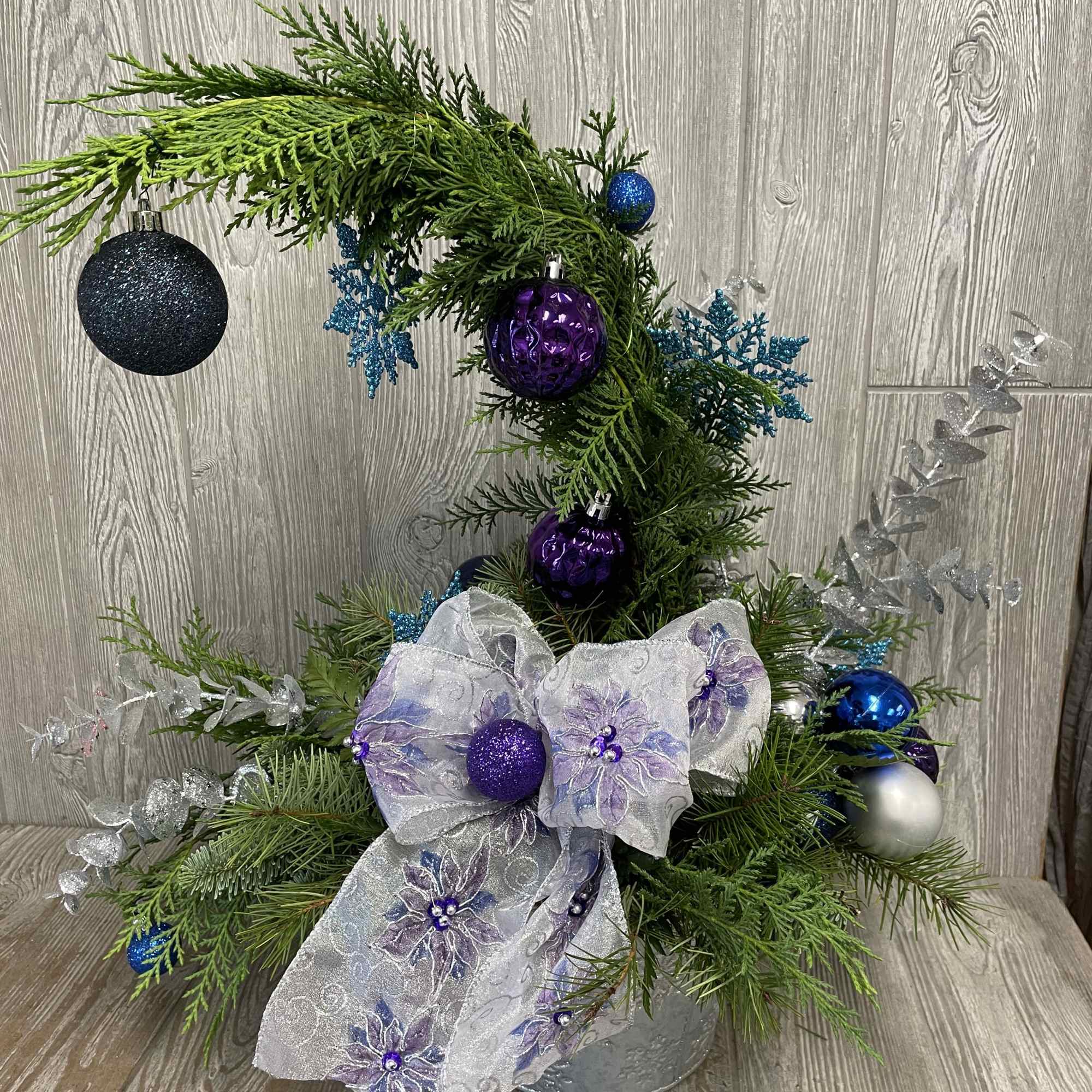 Whimsical and never the same.  Long-lasting evergreens decorated Whoville style. 