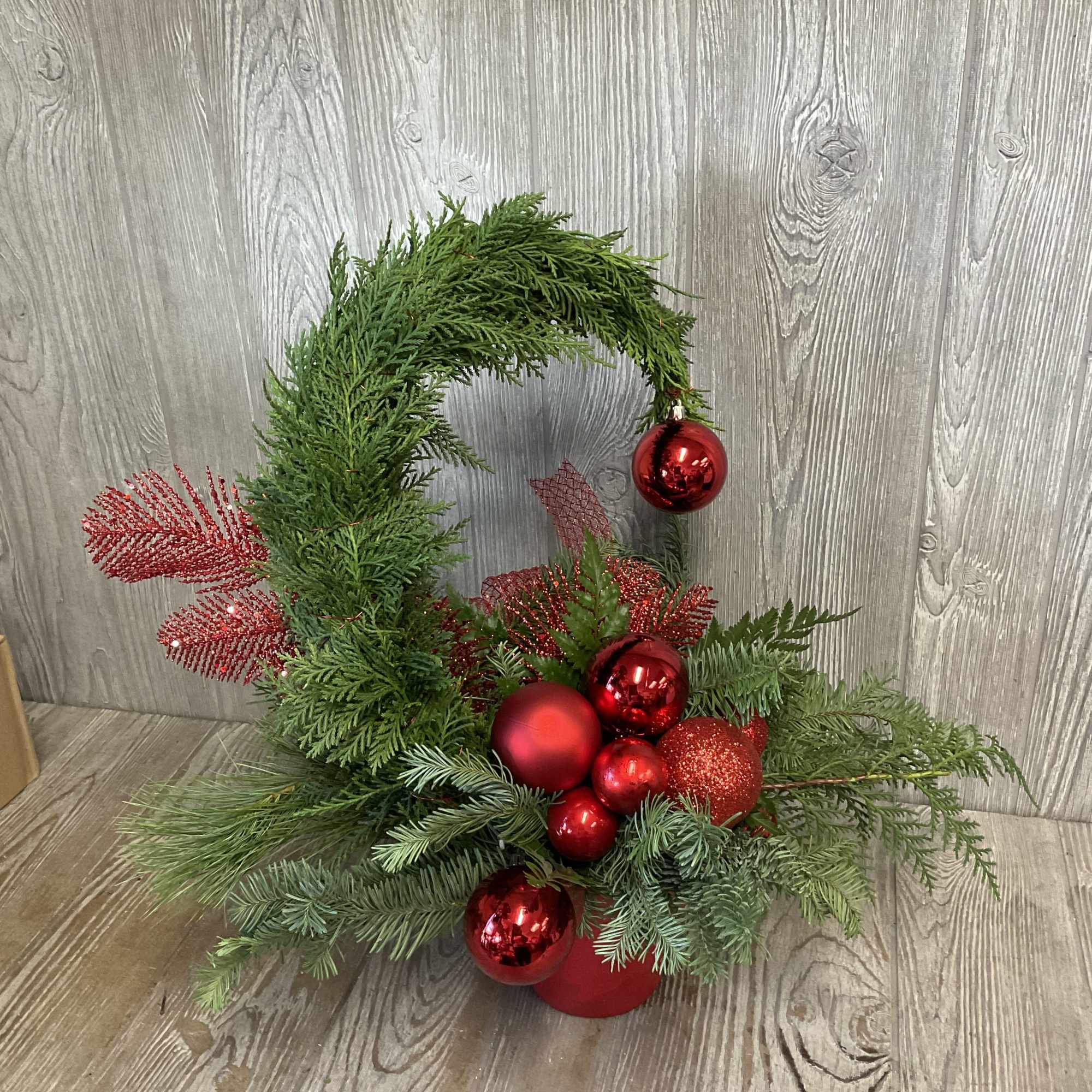 Whimsical and never the same.  Long-lasting evergreens decorated Whoville style. 