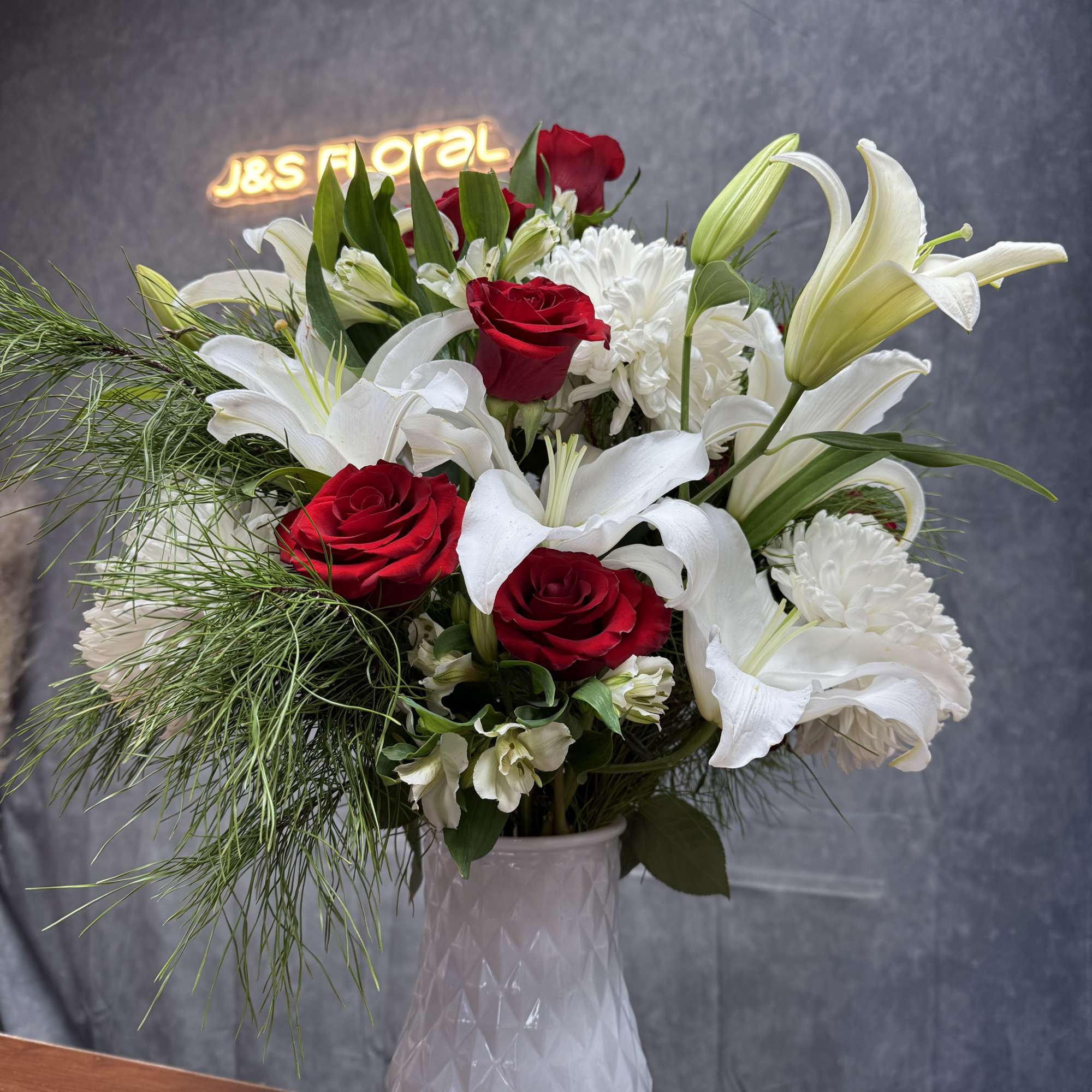 Celebrate the season with the timeless beauty of Winterberry whispers florals! J&amp;S