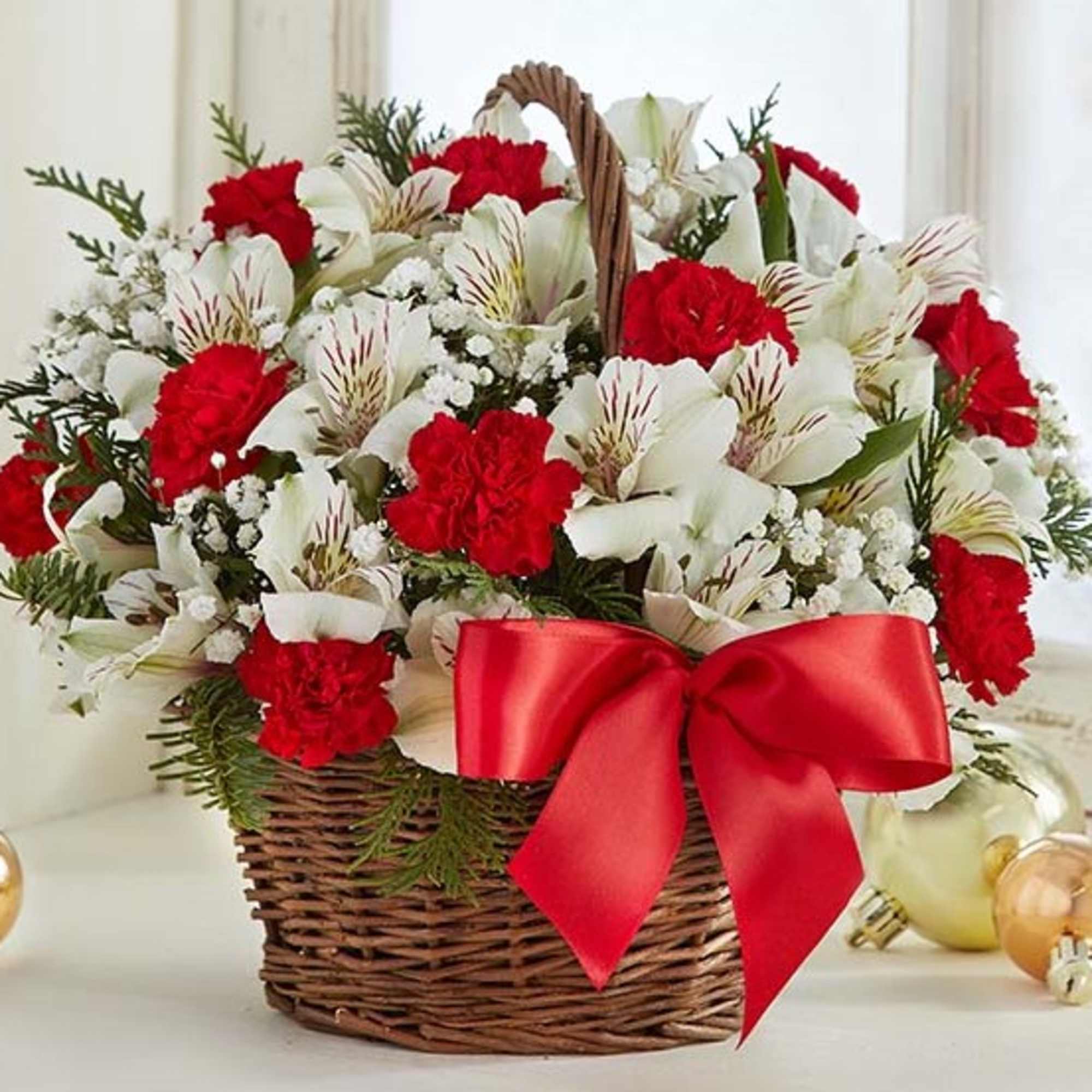 Spread holiday cheer with our basket of blooms. Capturing the natural beauty