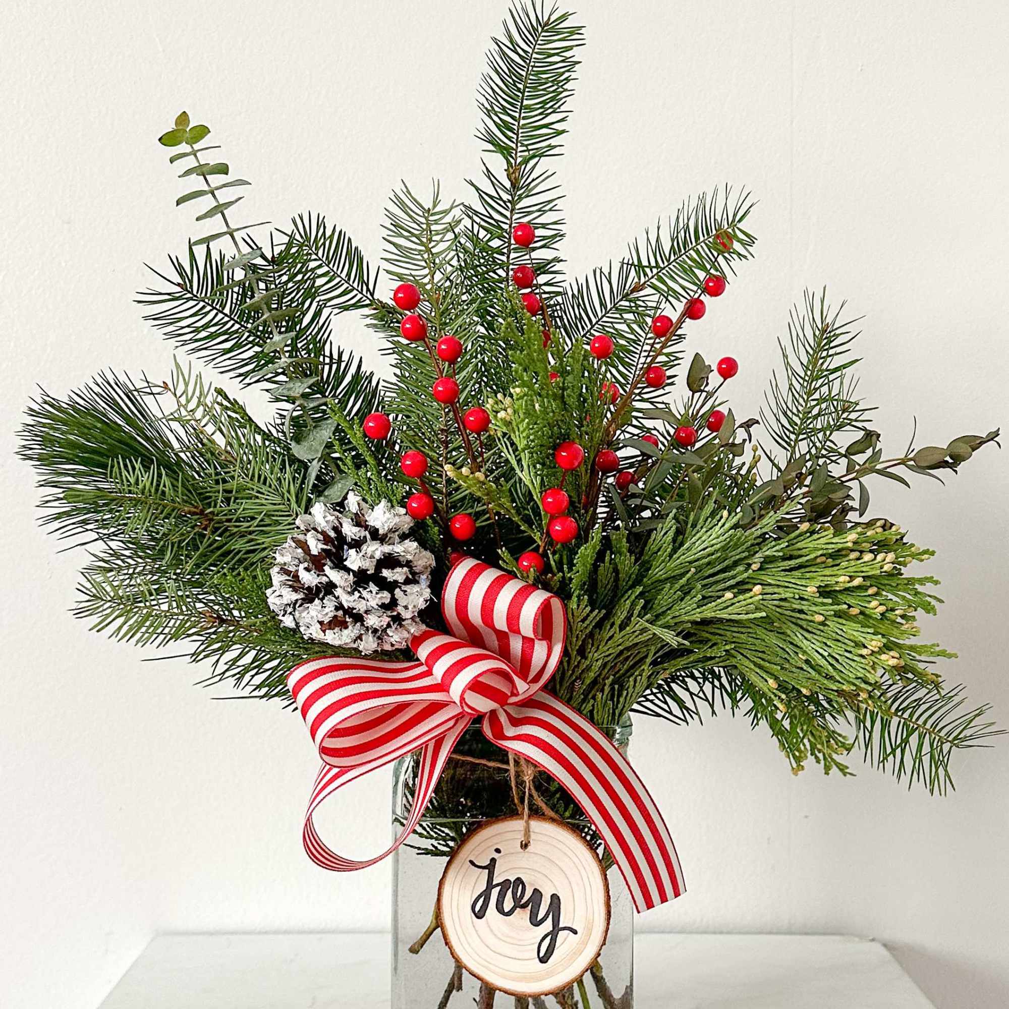 This arrangement is long lasting as it is full of greens, berries