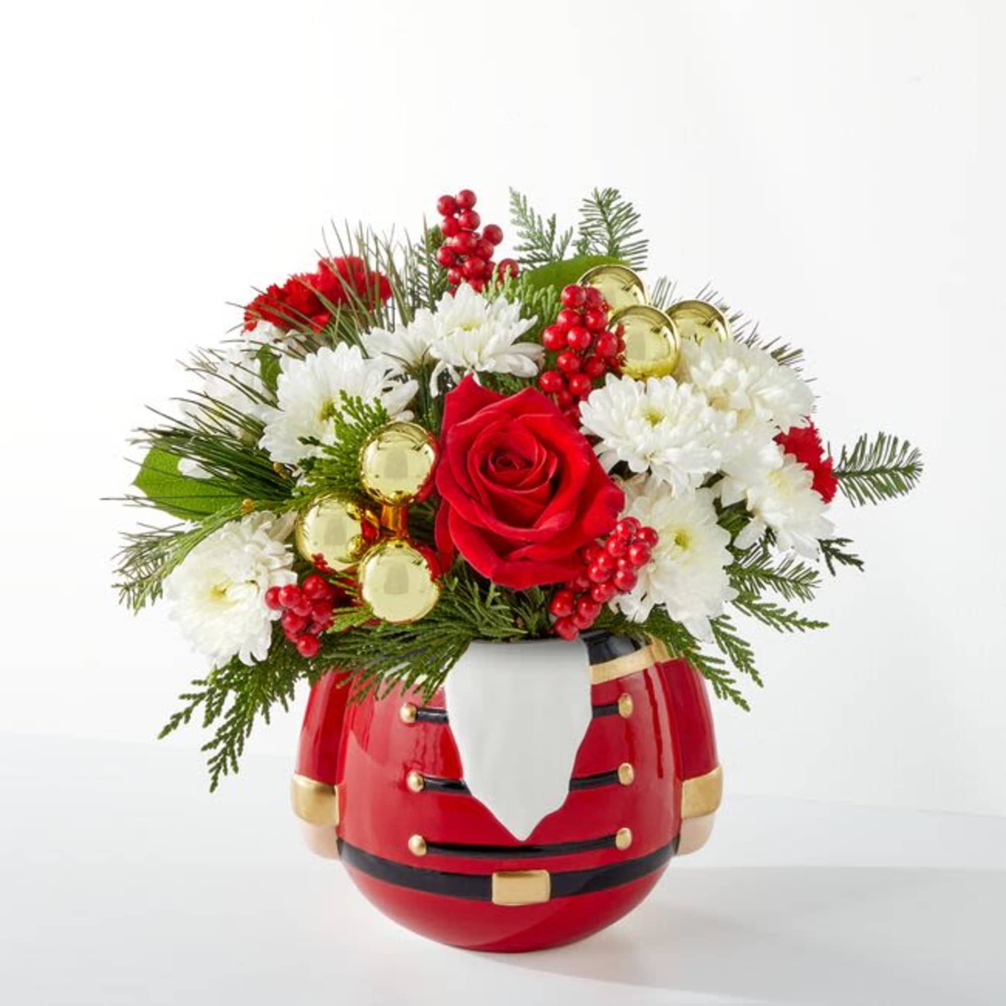 Seasonal flowers and greenery are designed in a ceramic nutcracker! 
