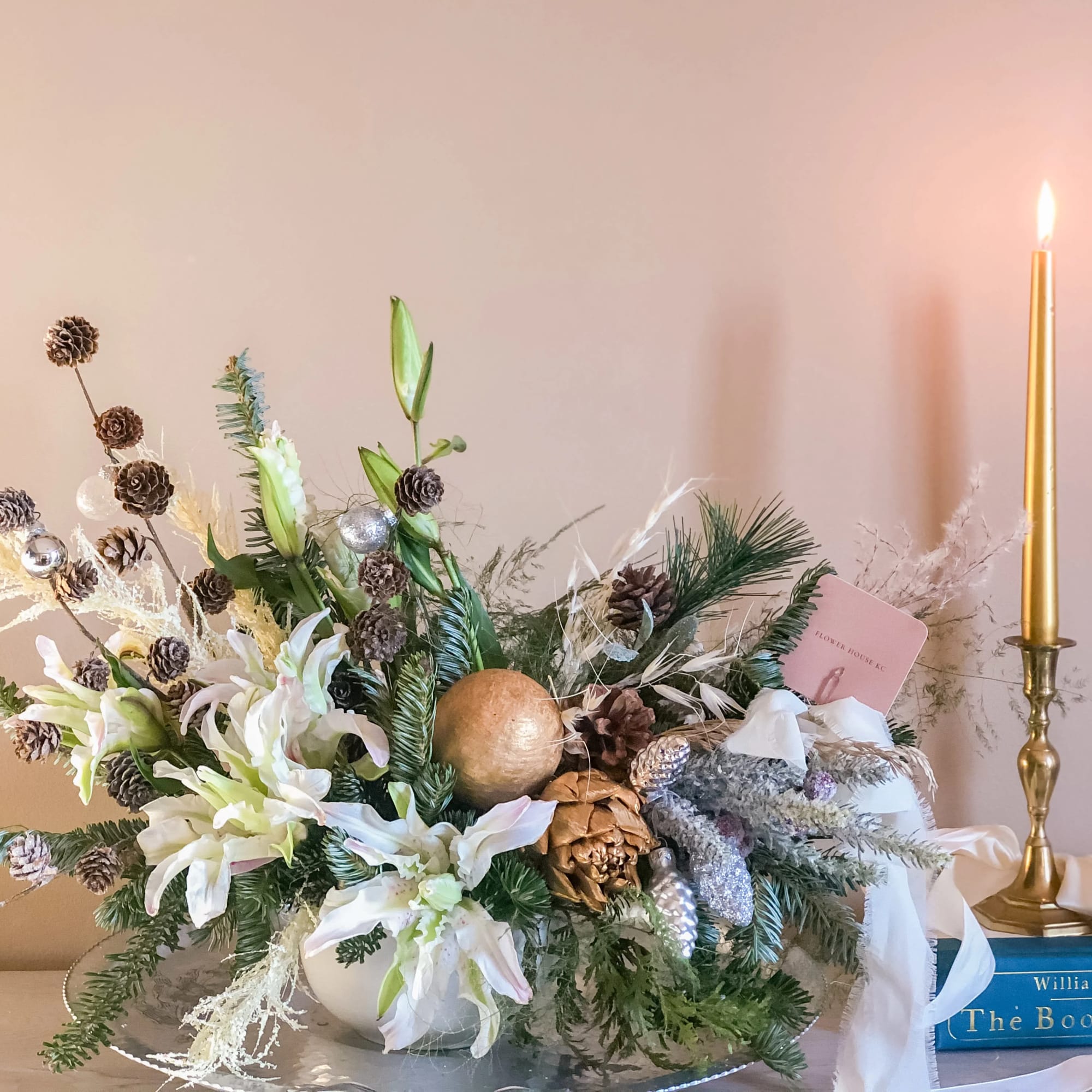 Dress up your holiday table with this fresh Christmas arrangement.  Featuring