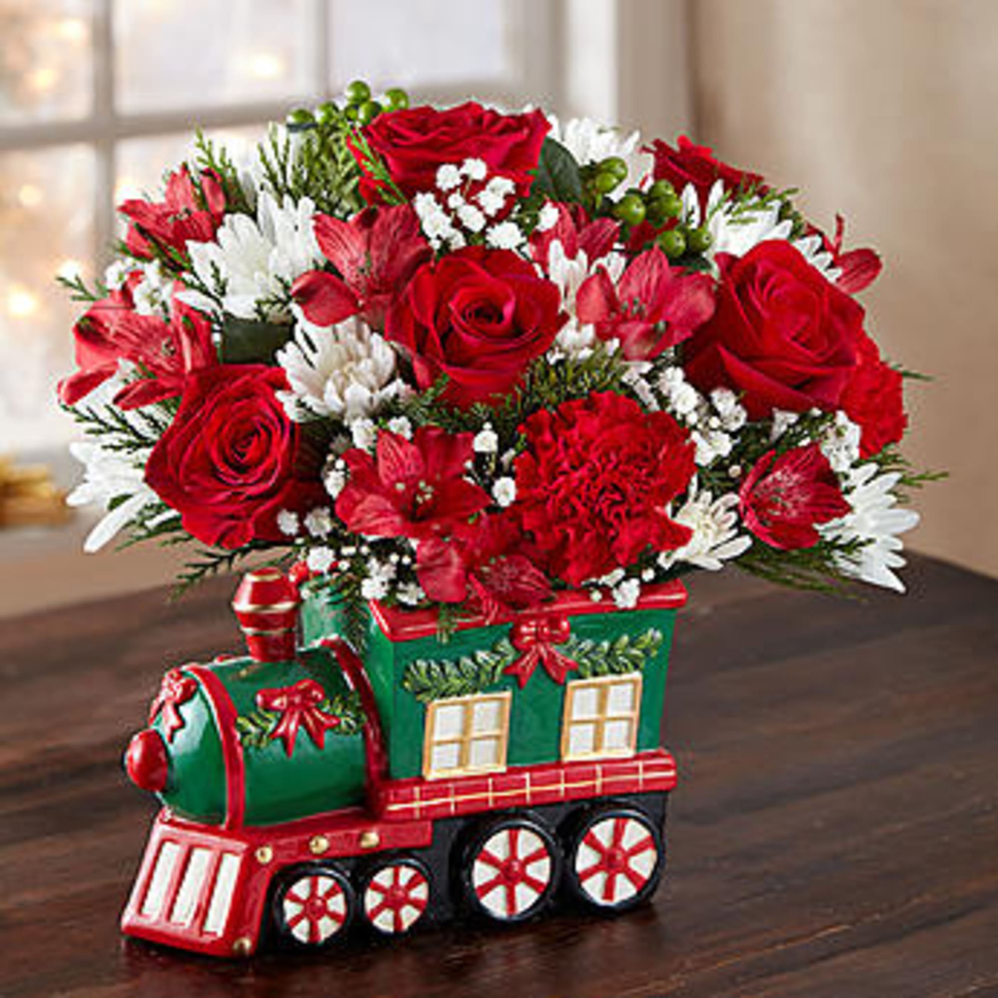  Our keepsake Christmas train arrangement will be pulling into the homes