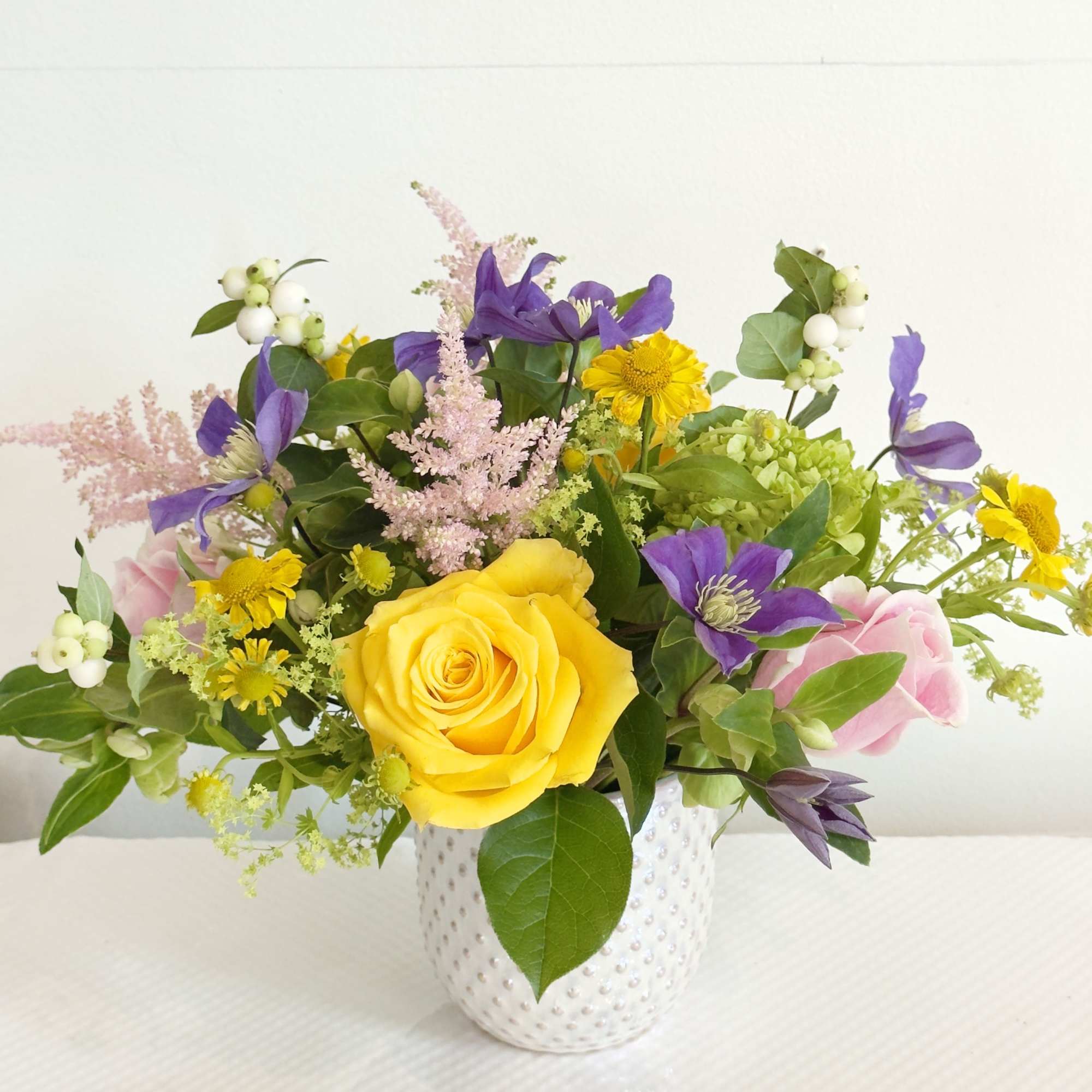 Brighten any space with the joyful elegance of our Summer Radiance arrangement.