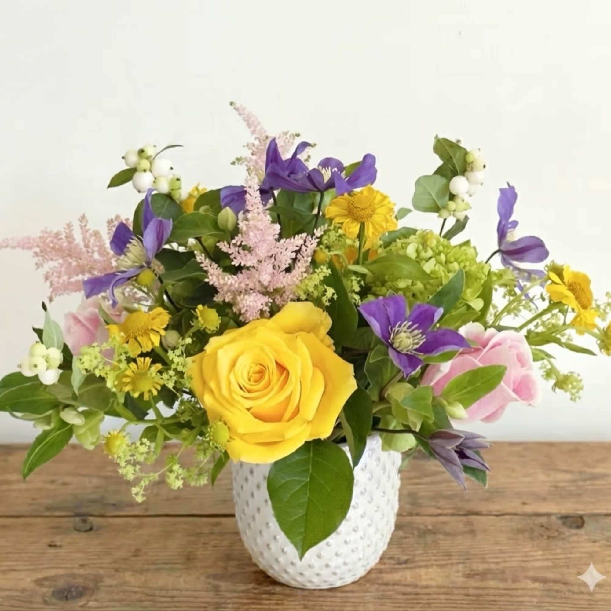 Brighten any space with the joyful elegance of our Summer Radiance arrangement.